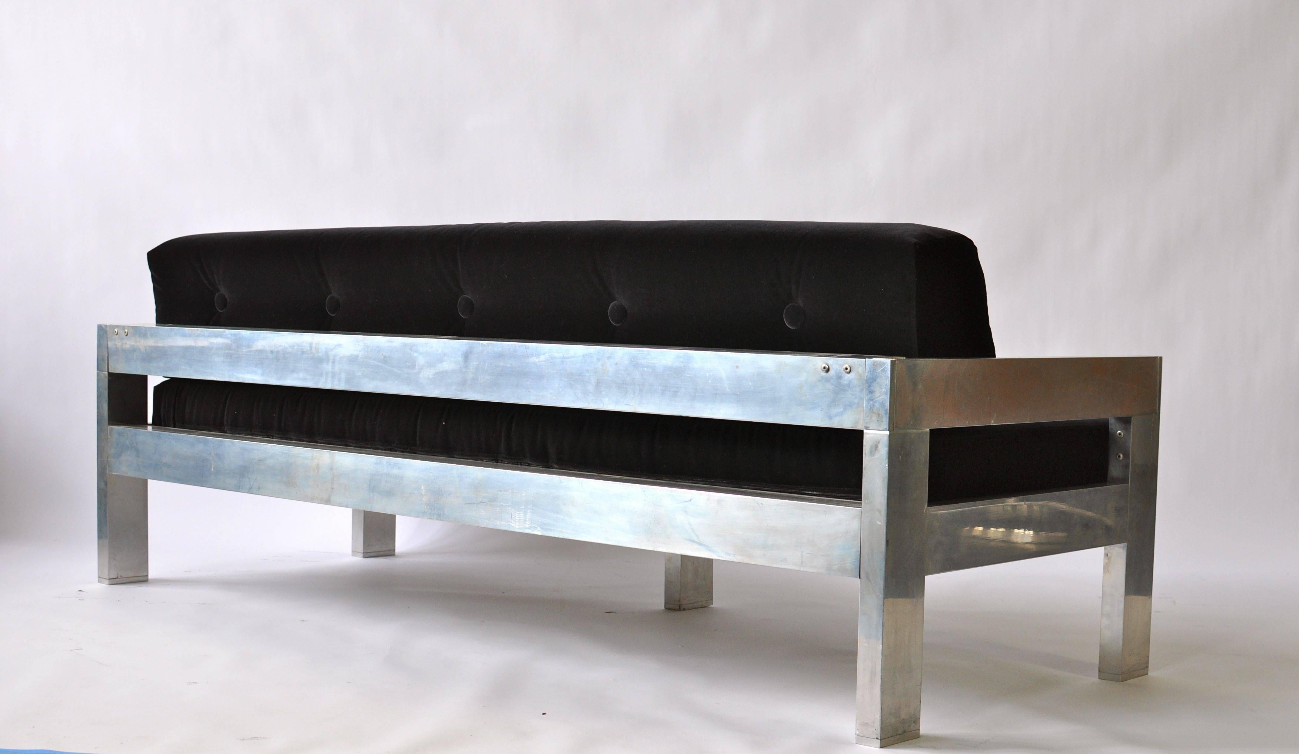 1970s polished aluminum frame sofa. Newly upholstered black velvet.