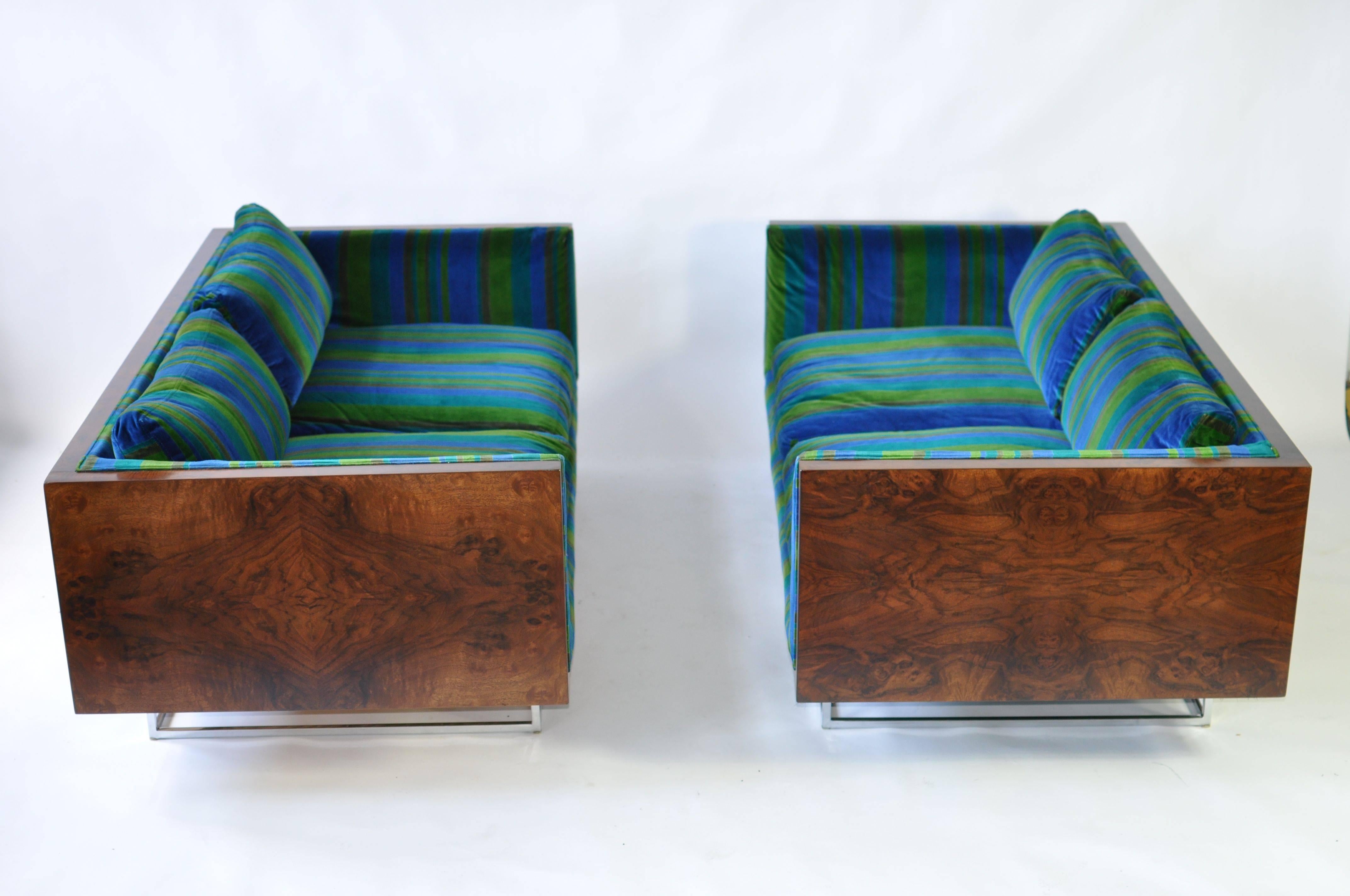 Pair of Milo Baughman rosewood settees. Sofas sit on a recessed chrome frame base. Original vintage Jack Lenor Larsen fabric.