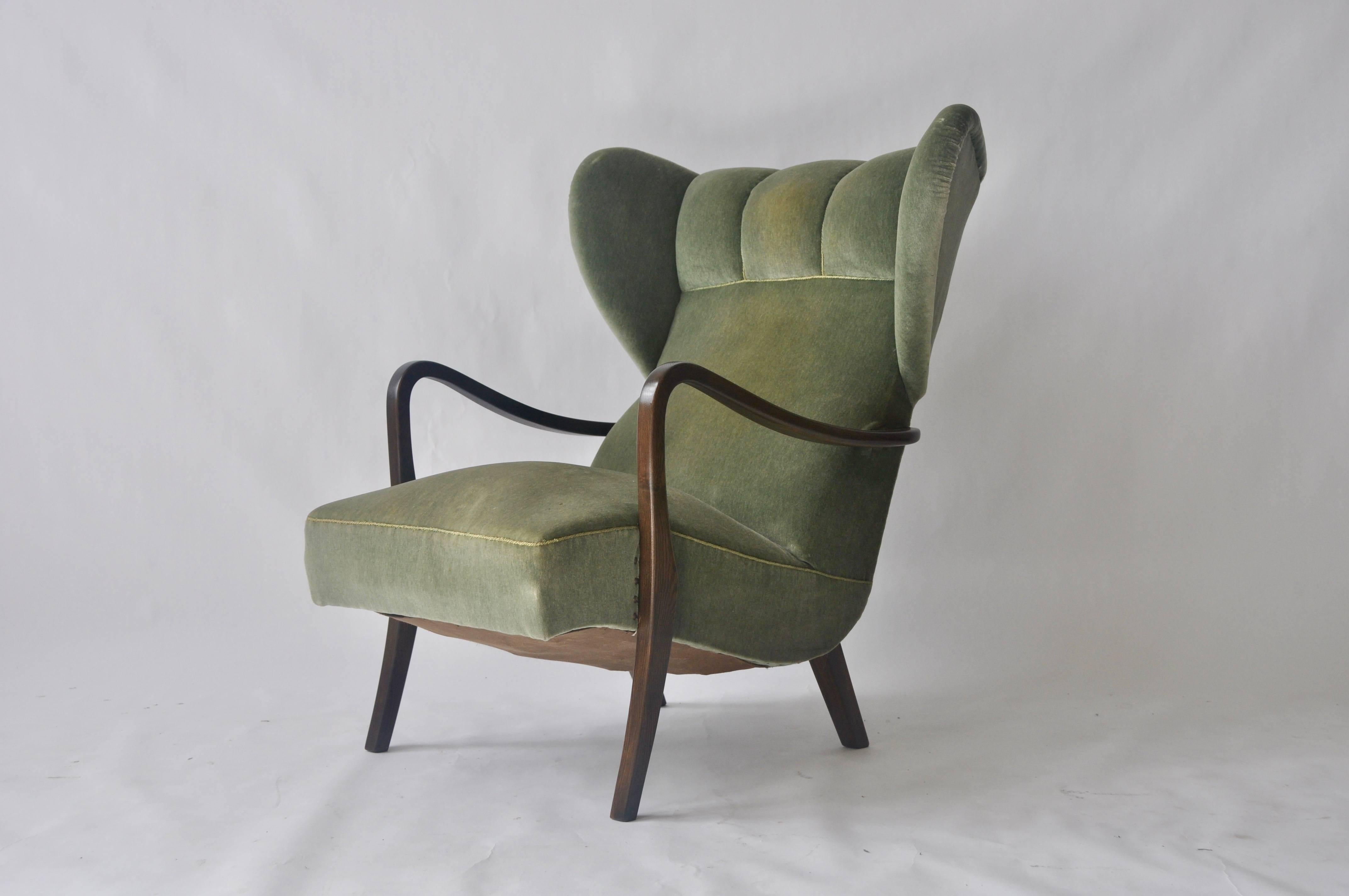 1950s Danish wingback lounge chair. 

33 inches wide at headrest and 24.5 wide at arms.