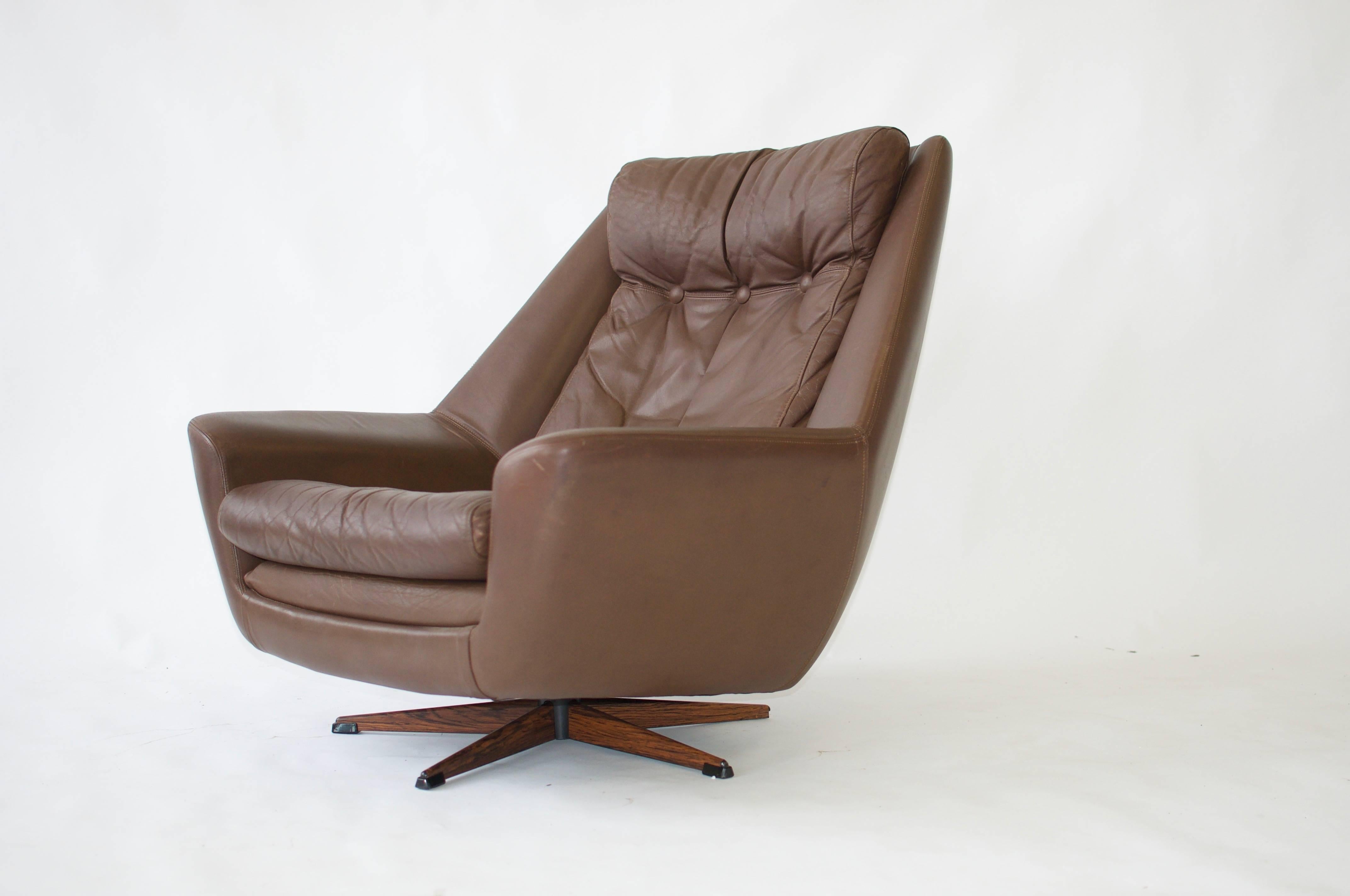 H. W. Klein swivel leather lounge chair.