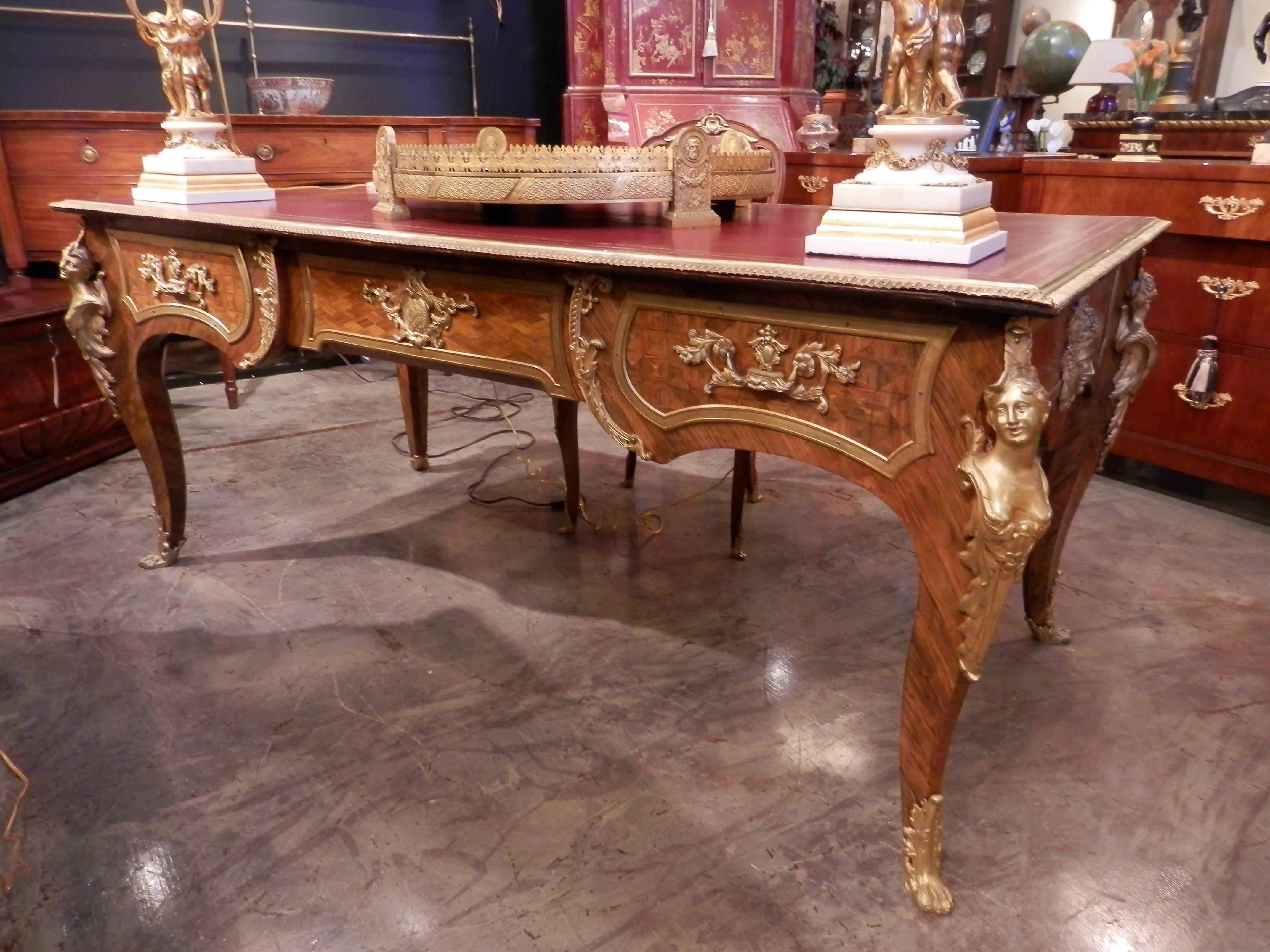 19th century French fine kingwood and gilt bronze figural head Louis XV large bureau plat. Original red leather top. Fine gilt bronze mounts. Female gilt bronze heads.