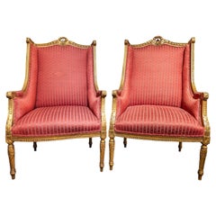 A fine pair of 19th century Italian Louis XVI gilded armchairs