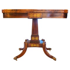 A fine 19th century Regency rosewood and brass inlayed gaming table