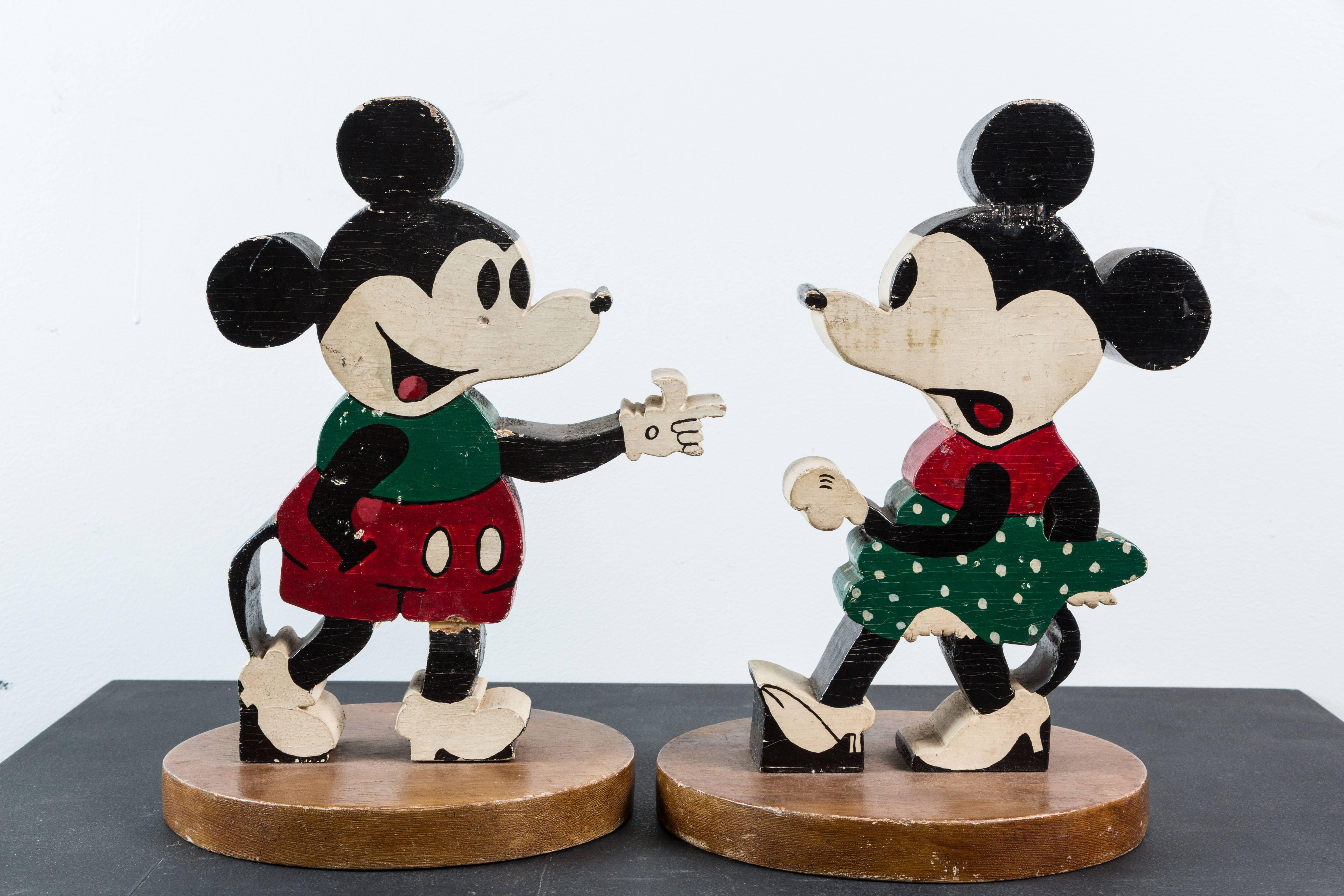 Vintage double-sided Mickey and Minnie Mouse wood carvings. Original paint surface, circa 1940s found in New York. 

Mickey's dimensions are 9.75