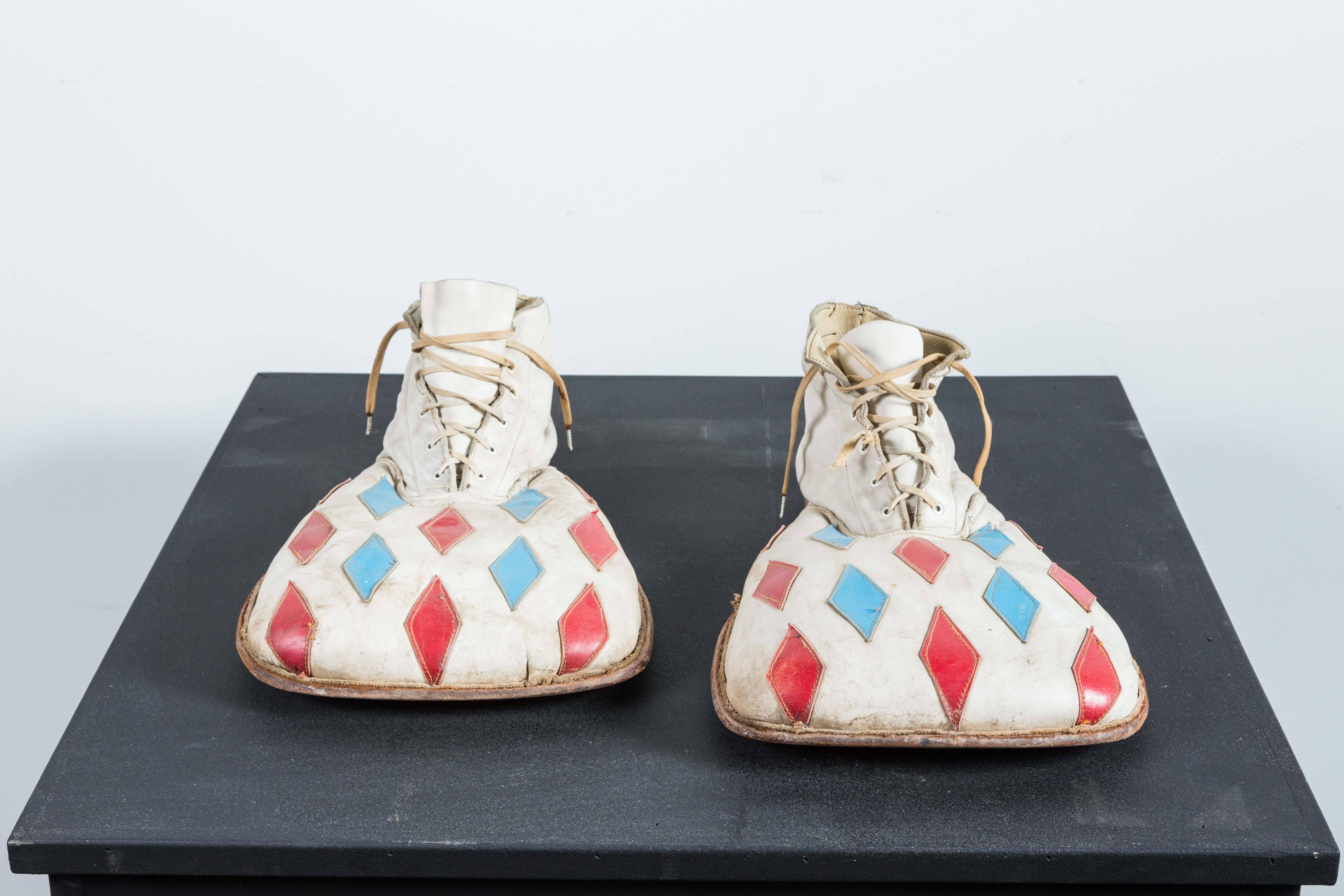 Fantastic pair of vintage custom carnival or circus clown shoes with red and blue diamond stitched designs.