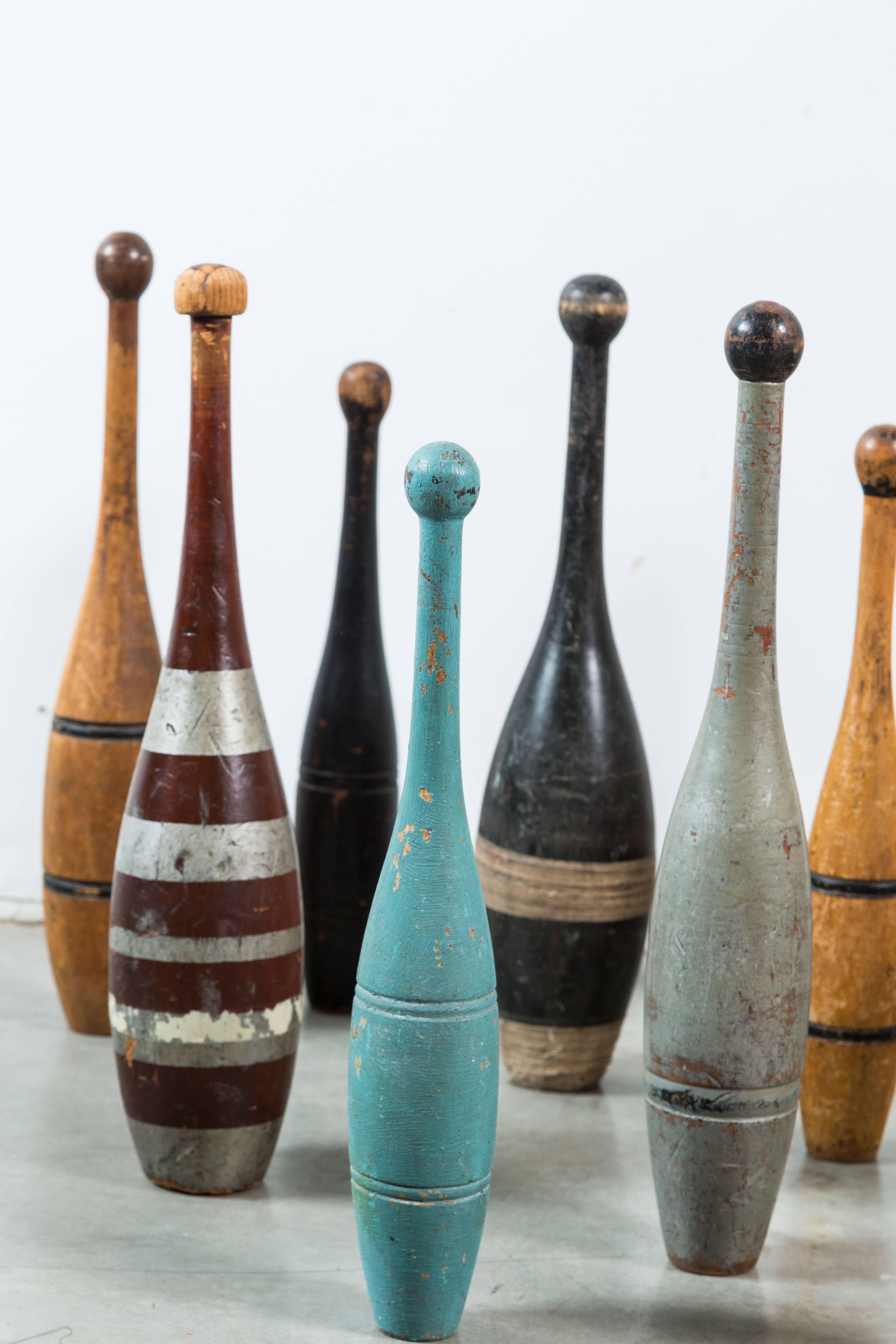 Large collection of 15 Indian clubs or juggling pins with original paint surface. Great alligatored patina on many. Late 19th and early 20th century clubs. Indian clubs rose to popularity in the US during the health craze of the late Victorian era.