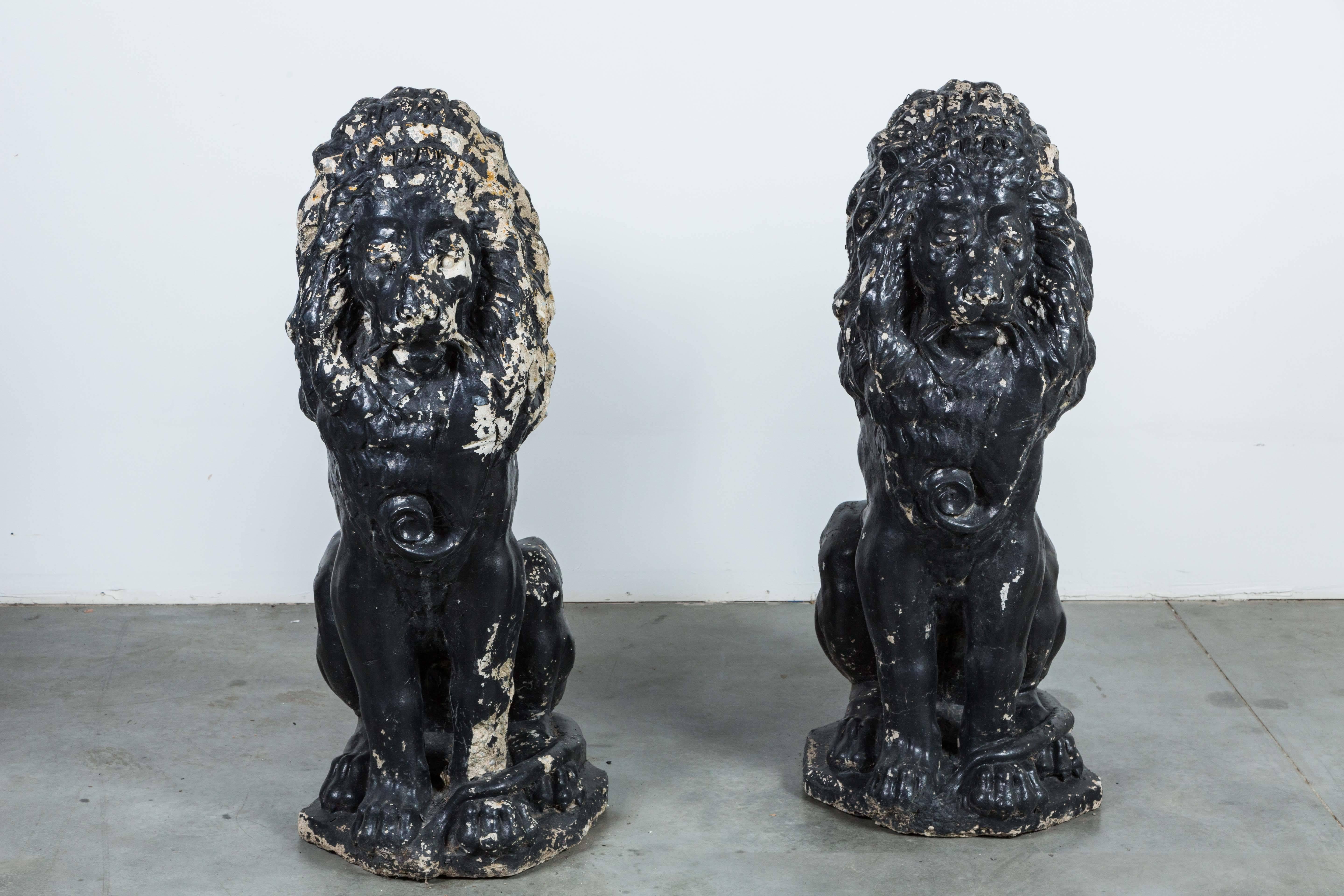 Pair of majestic entry lions found at an estate on Lake Michigan. Black paint surface. Large and imposing presence. Very heavy and solid statuary.