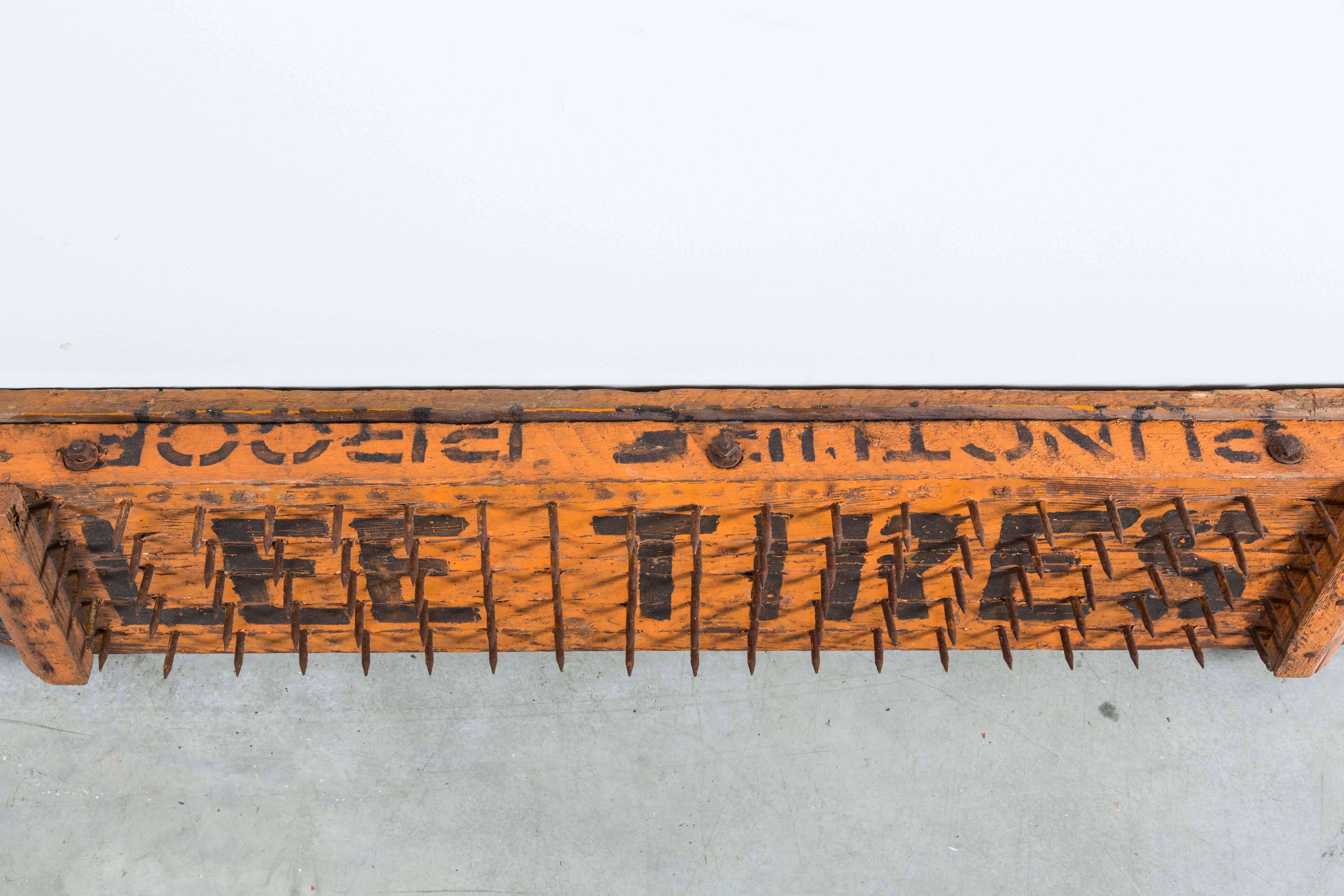 Early 20th century Lee Tires puncture proof trade sign. Handmade and painted wood and nail construction. Great orange and black paint surface.