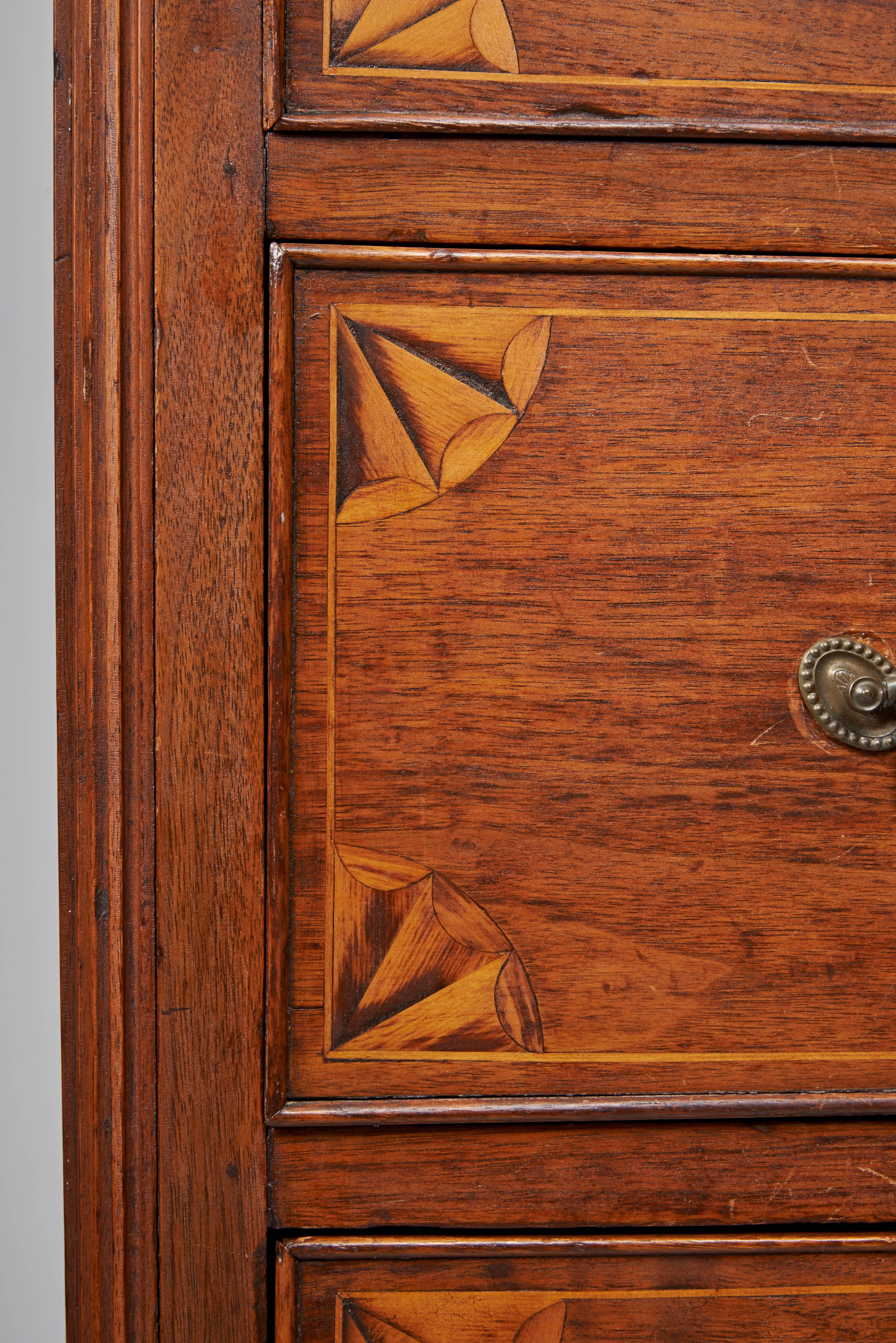 Walnut Chippendale high chest of drawers corners of drawers inlaid with fan designs nice drawer arrangement bale and rosette brasses fluted corners terminating in ogee feet.