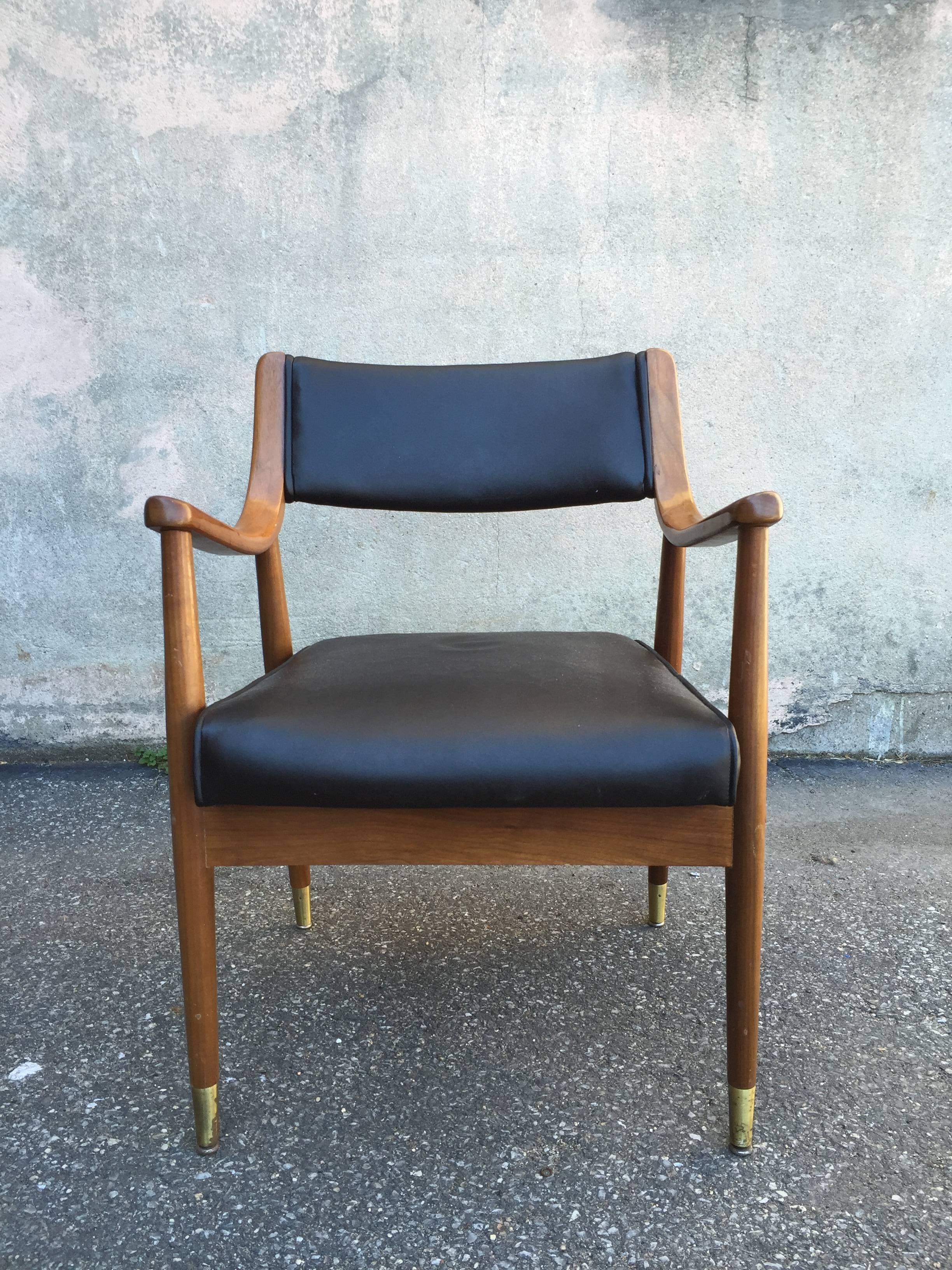 Great pair of captain chairs in the manner of Edward Wormley for Dunbar, with brass sabots.  These are on sale for clearance price.