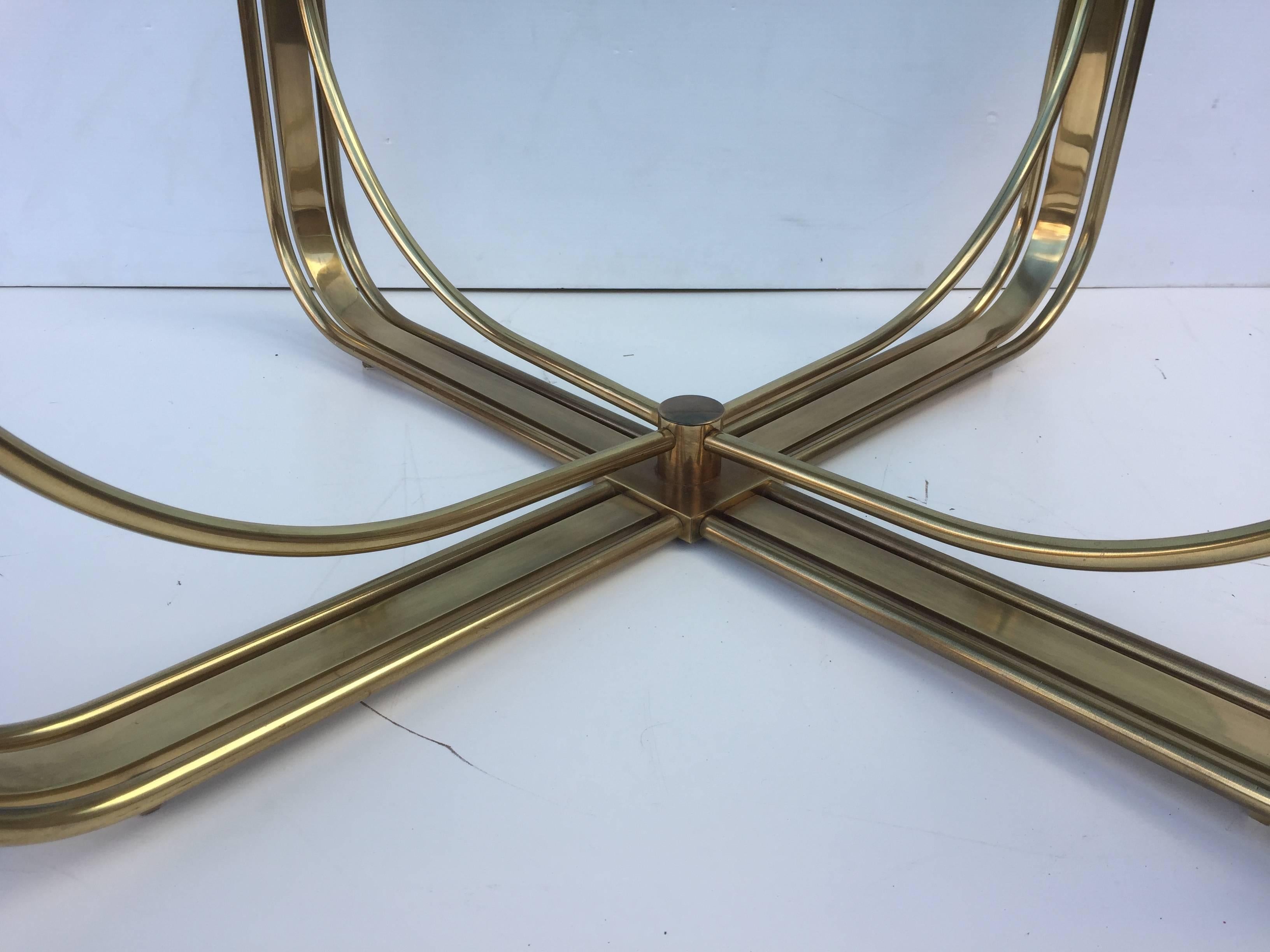 American Brass and Glass Four Post Cocktail Table For Sale