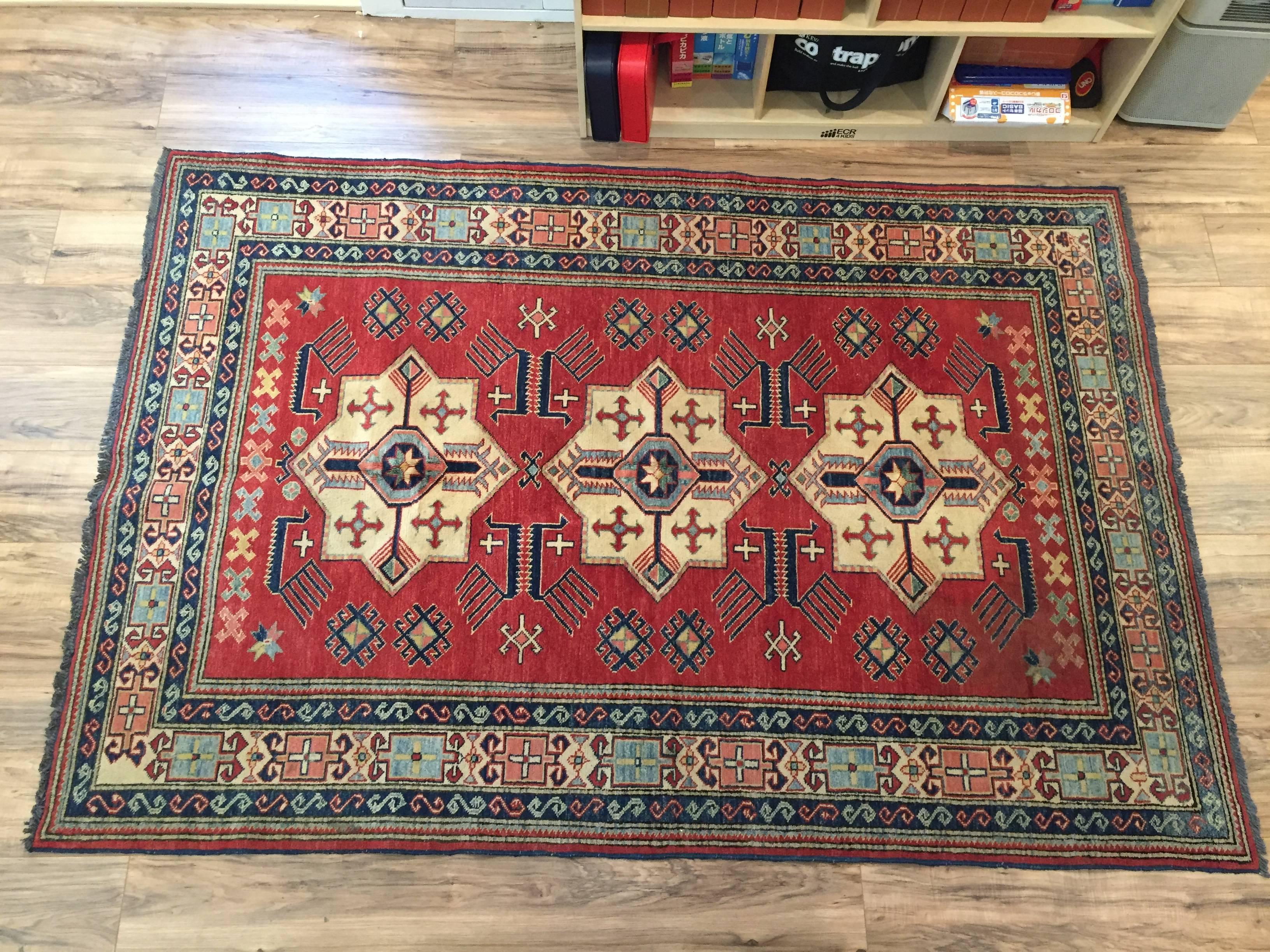 Triple medalion handwoven Persian rug style carpet, possibly caucasion.