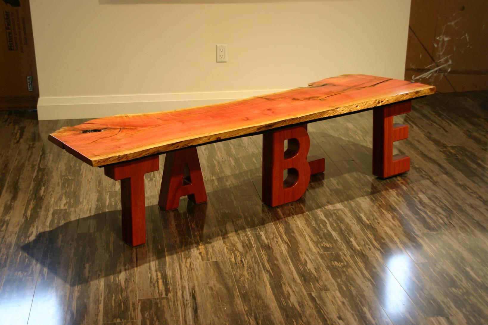 A modern pink ivory wood coffee table designed by Nick Malcolm.
Signed.