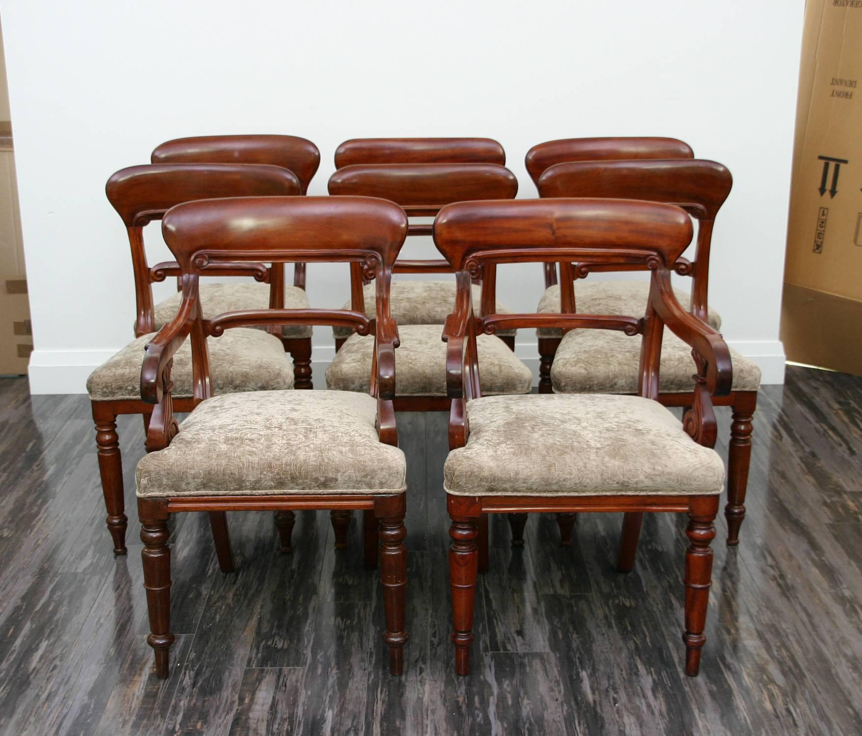 Set of eight chairs.
Armchair: 33.75" high x 21" wide x 19" deep. Seat height: 18.5".
Sidechair: 33.75" high x 19.25" wide x 16" deep. Seat height: 18.5".
Table (closed): 28.5" high x 44.5" wide x