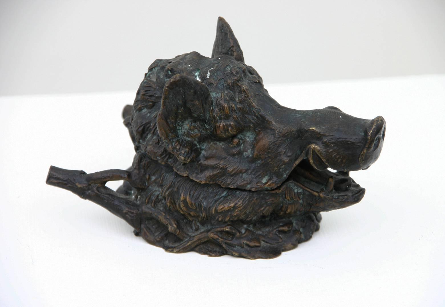 A French 19th century bronze inkwell in the form of a Boar's head with glass ink pot.
Marked: Fratin,
1800-1864.