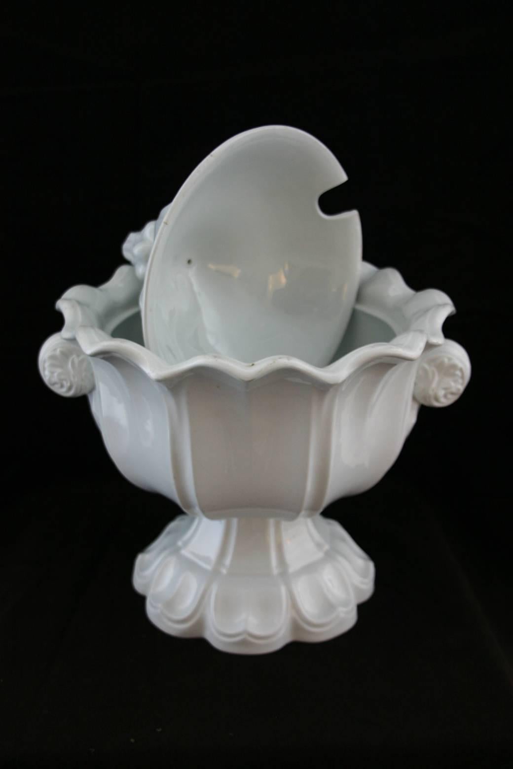 A 19th century ironstone soup tureen with ladle.
