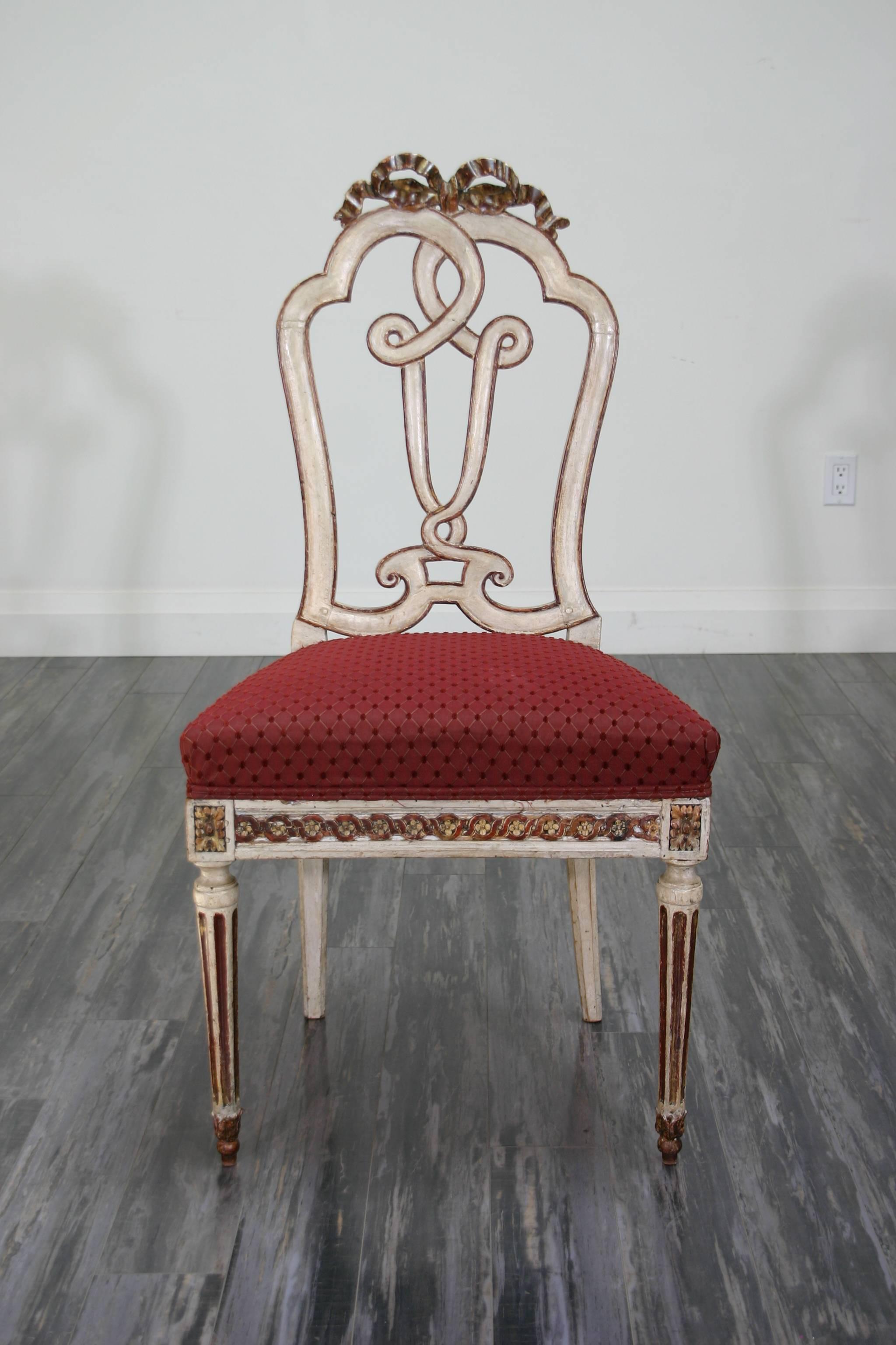 A set of ten 18th century Continental painted and parcel-gilt dining chairs.