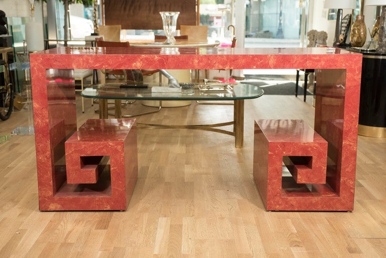 This awesome custom designed rouge faux marble table is a dynamic addition to a daring decor. It is made of wood that has been veneered with a hard plastic laminate.