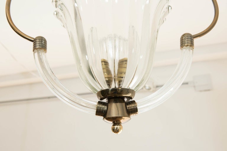 A perfect pair of single light Murano pendants with brass details. Rewired for North America.