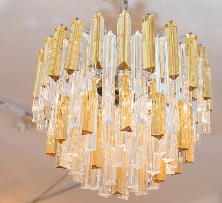 A beautifully proportioned and vibrant crystal chandelier with yellow 
and Classic clear crystals by Venini. The interior is fitted with four lights and the frame is in chromed metal. Its wired for USA and ready to hang.