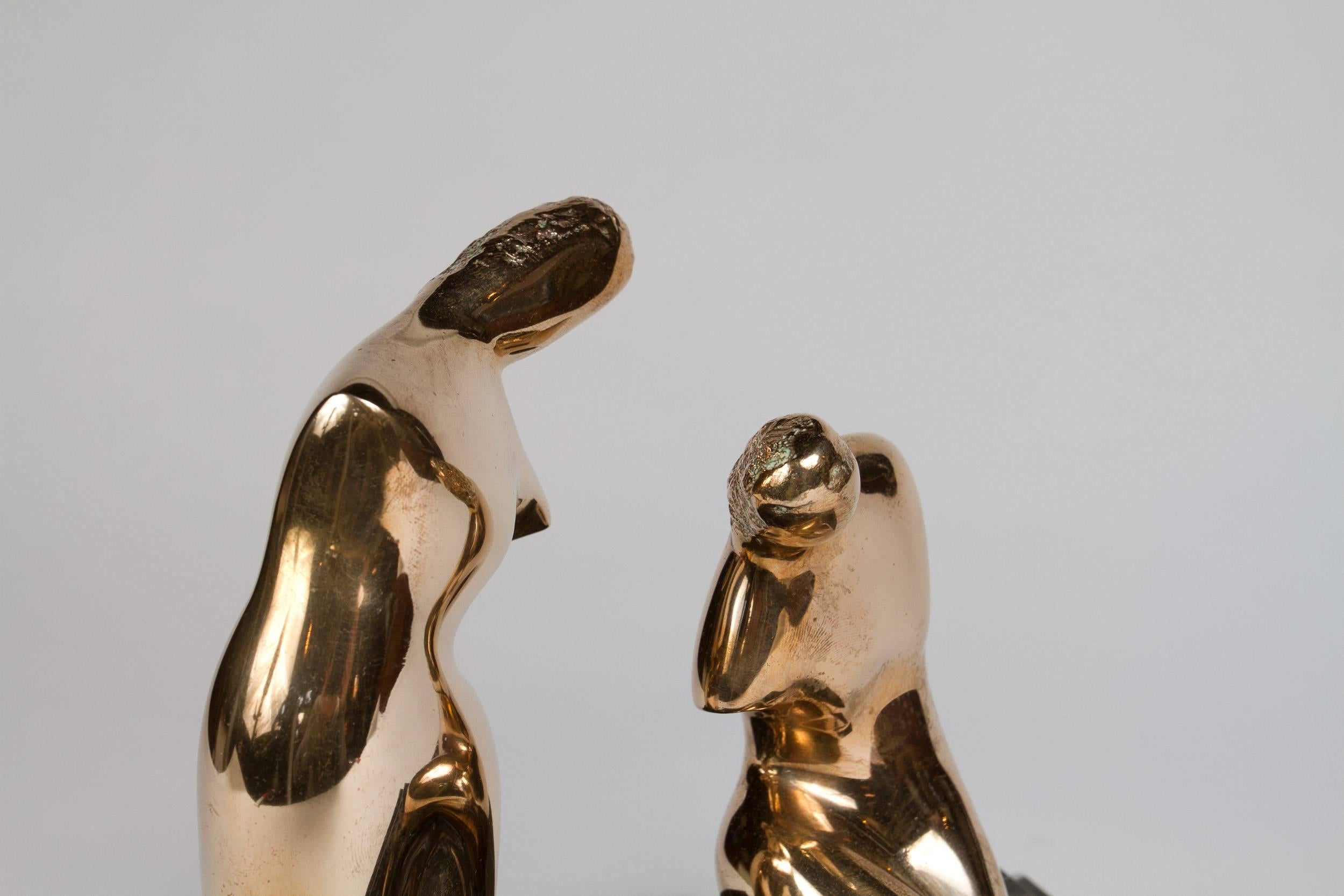 Polished bronze abstract sculpture of two woman on a rectangular double marble base signed: L S 4.