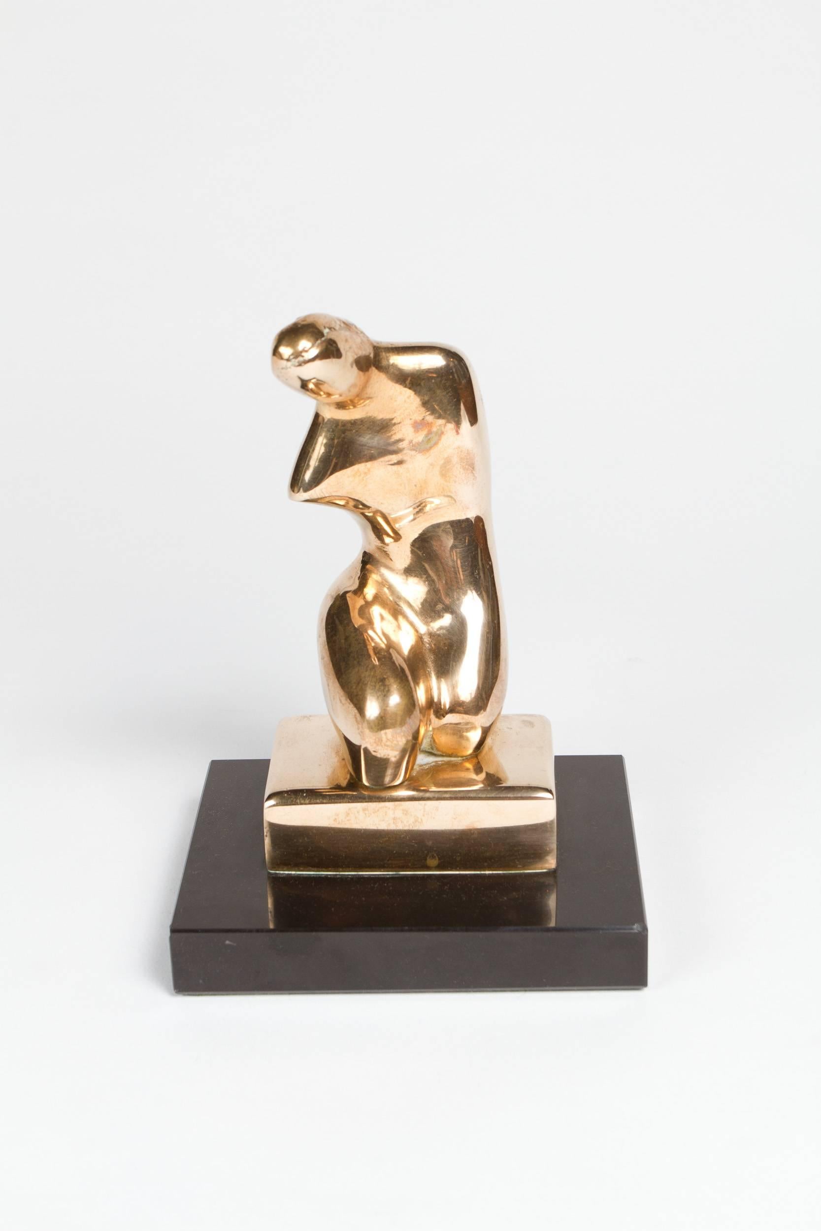 Polished bronze abstract sculpture of a kneeling woman. Signed: L S 1.