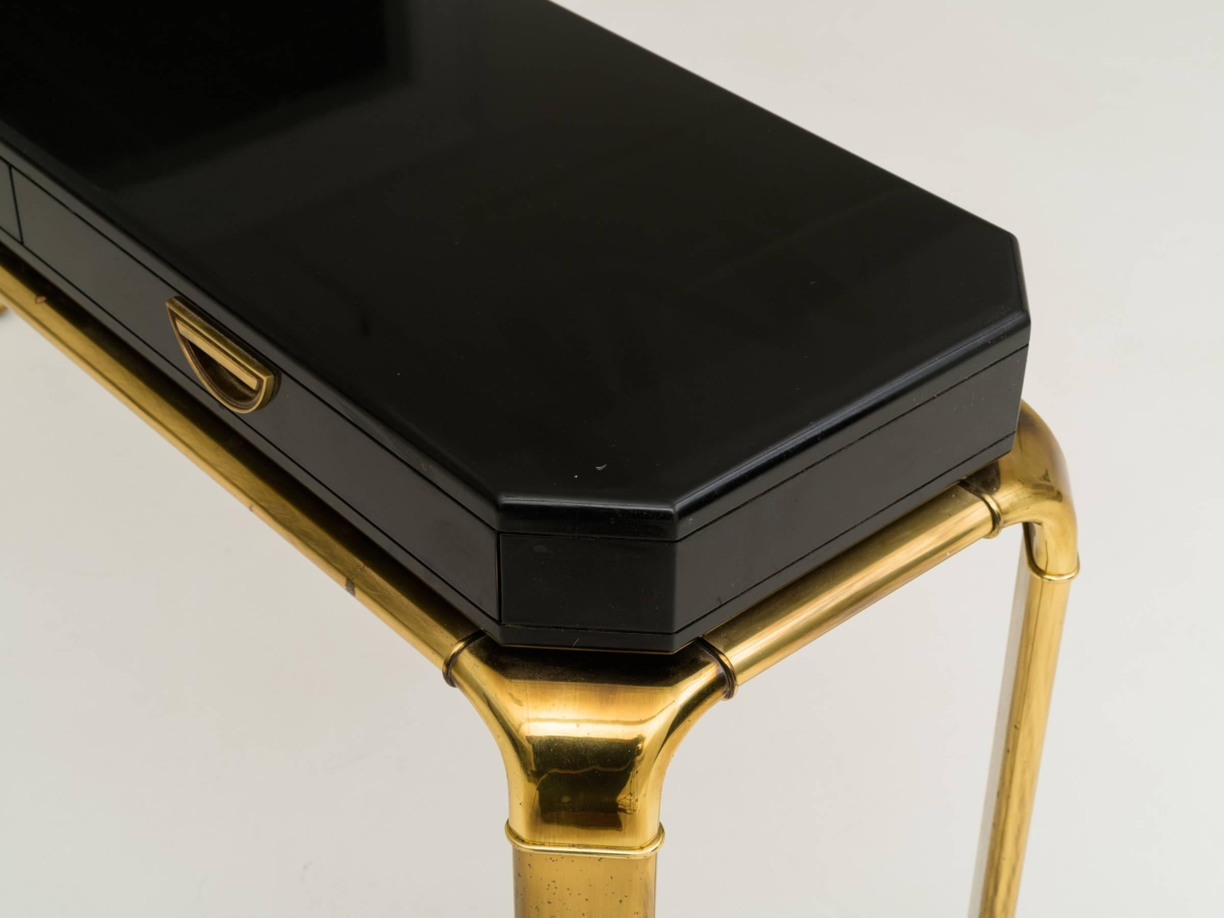 Great black lacquered and brass three-drawer console table by John Widdicomb for Mastercraft.