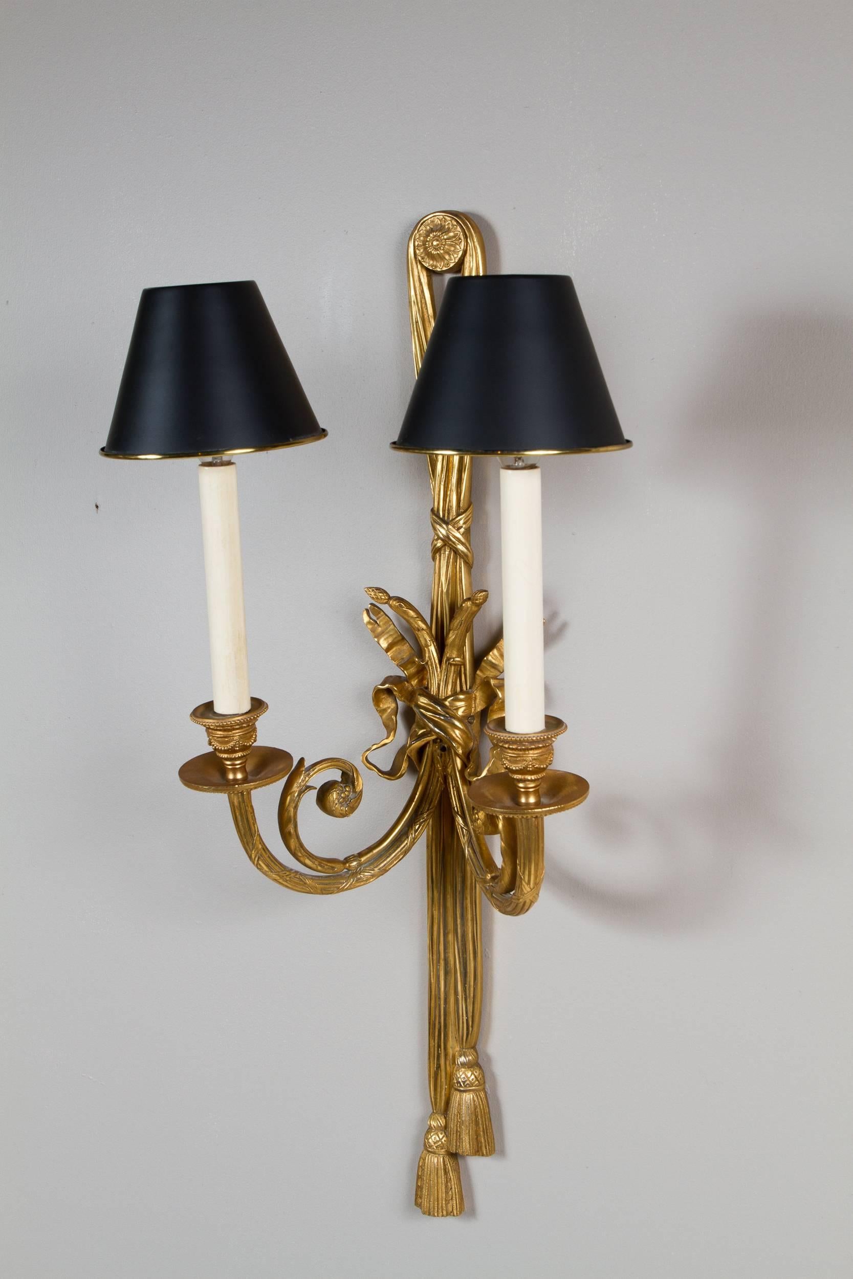 Great pair of Louis XVI style gilt bronze sconces, fitted with black metal shades, France, circa 1900.
