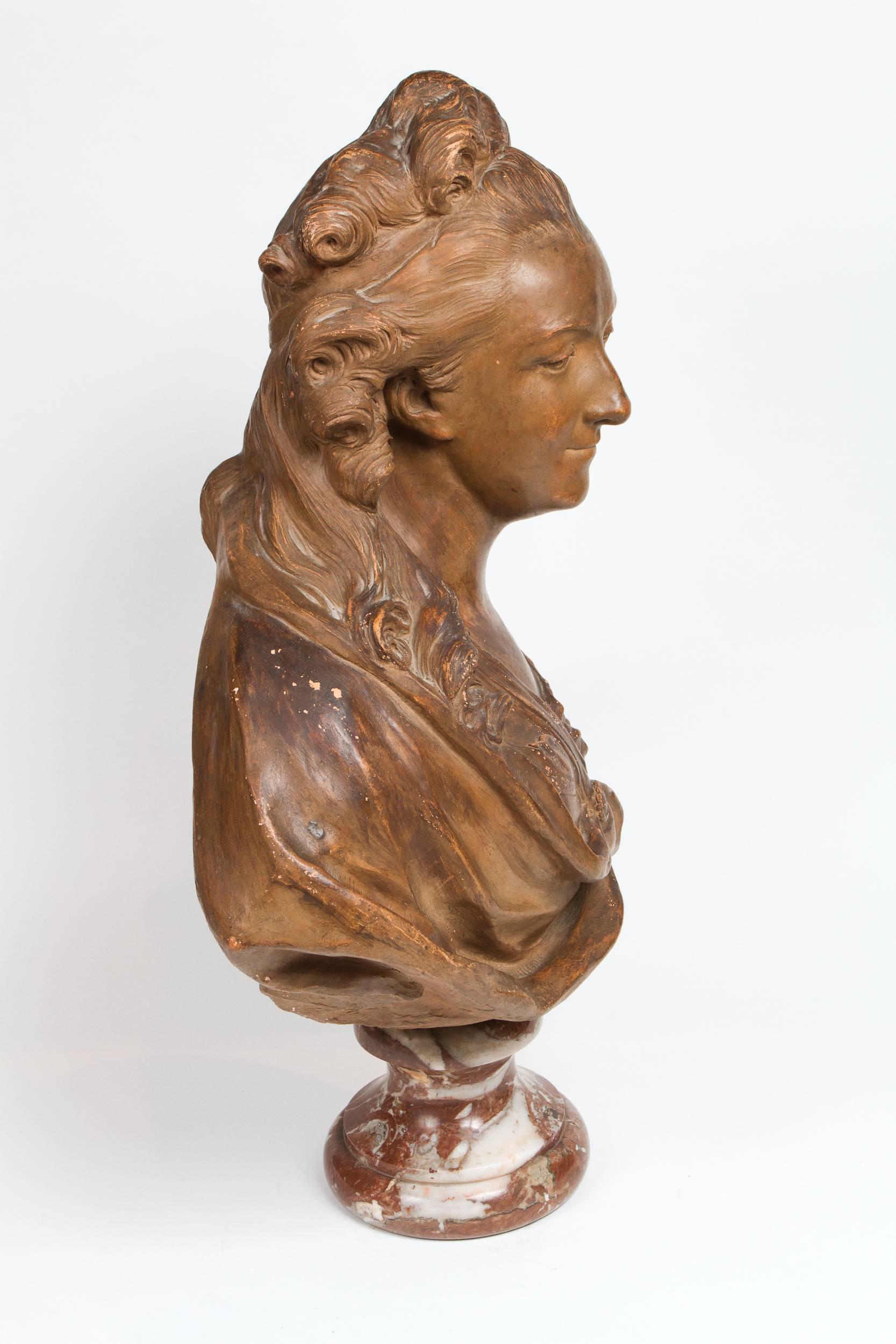 Important terracotta bust of Madame du Barry resting on a Rouge de Languedoc marble base, beautiful patination, inscribed on back: 