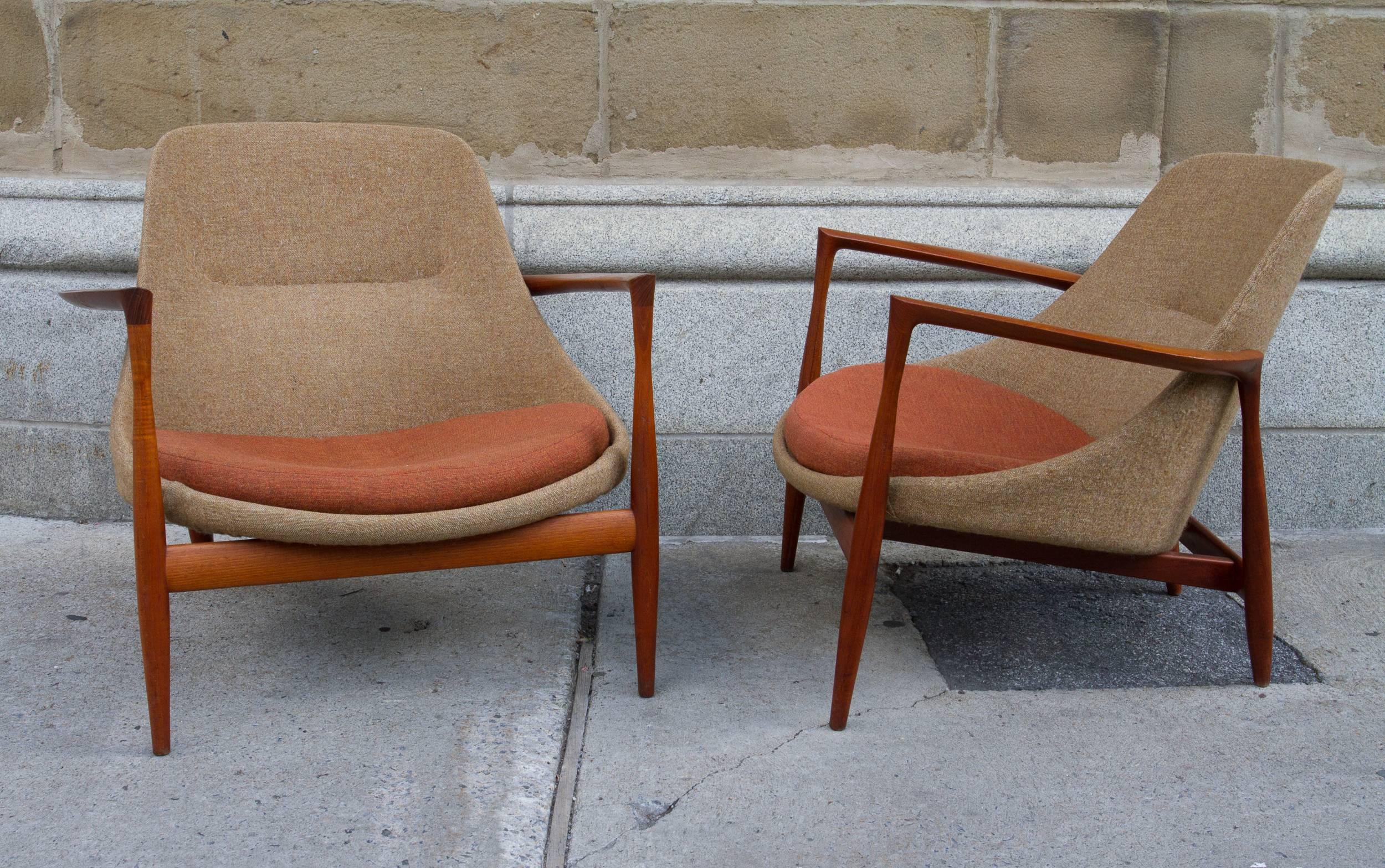 Exceptional pair of teak Kofod-Larsen Elizabeth chairs. Manufactured by Christensen and Larsen model U-56. Both bearing burnt in makers stamp on bottom. Original wool upholstery, 1956.