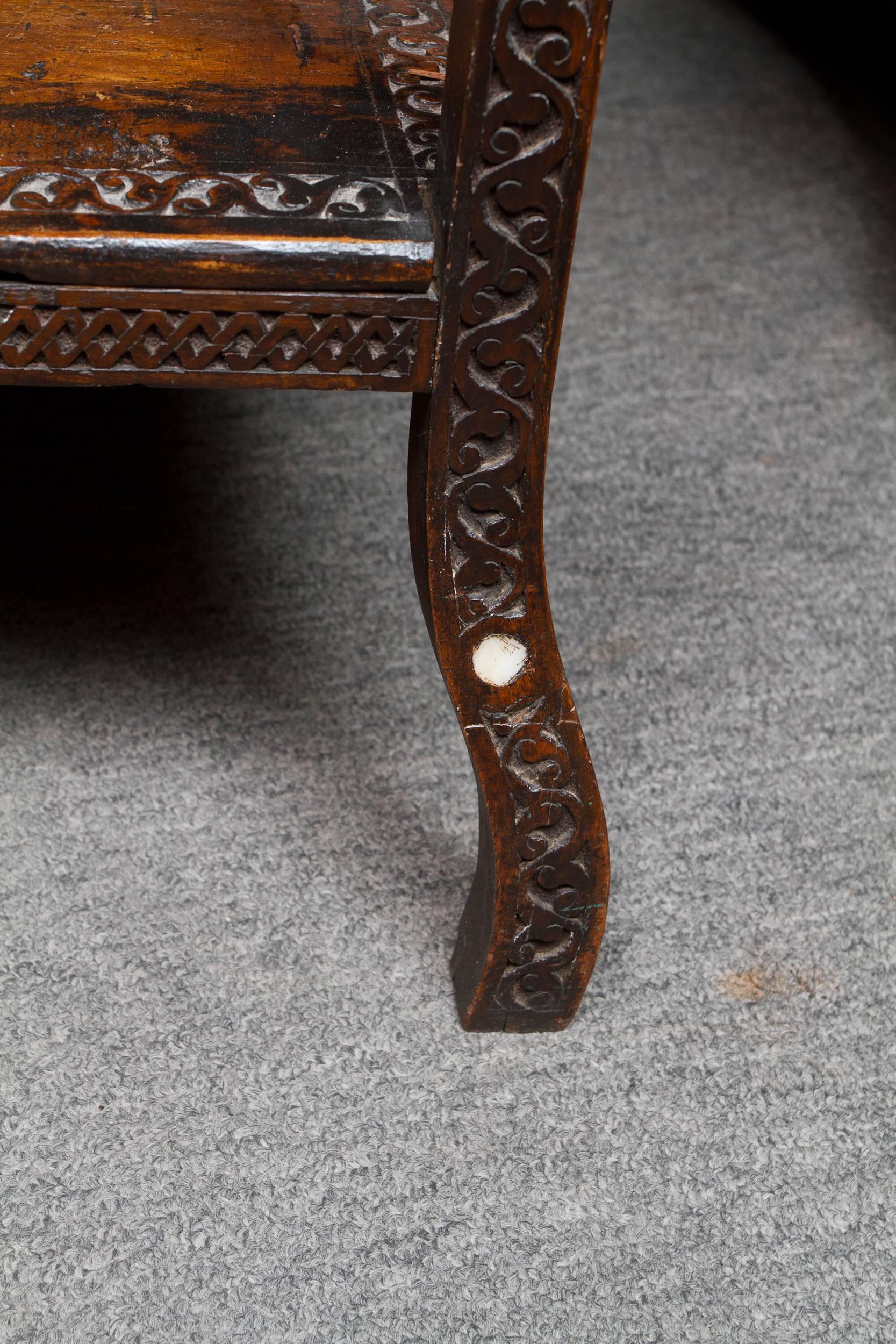 Syrian hand-carved walnut side table inlaid with mother-of-pearl, the top featuring a carved poem in Arabic calligraphy.