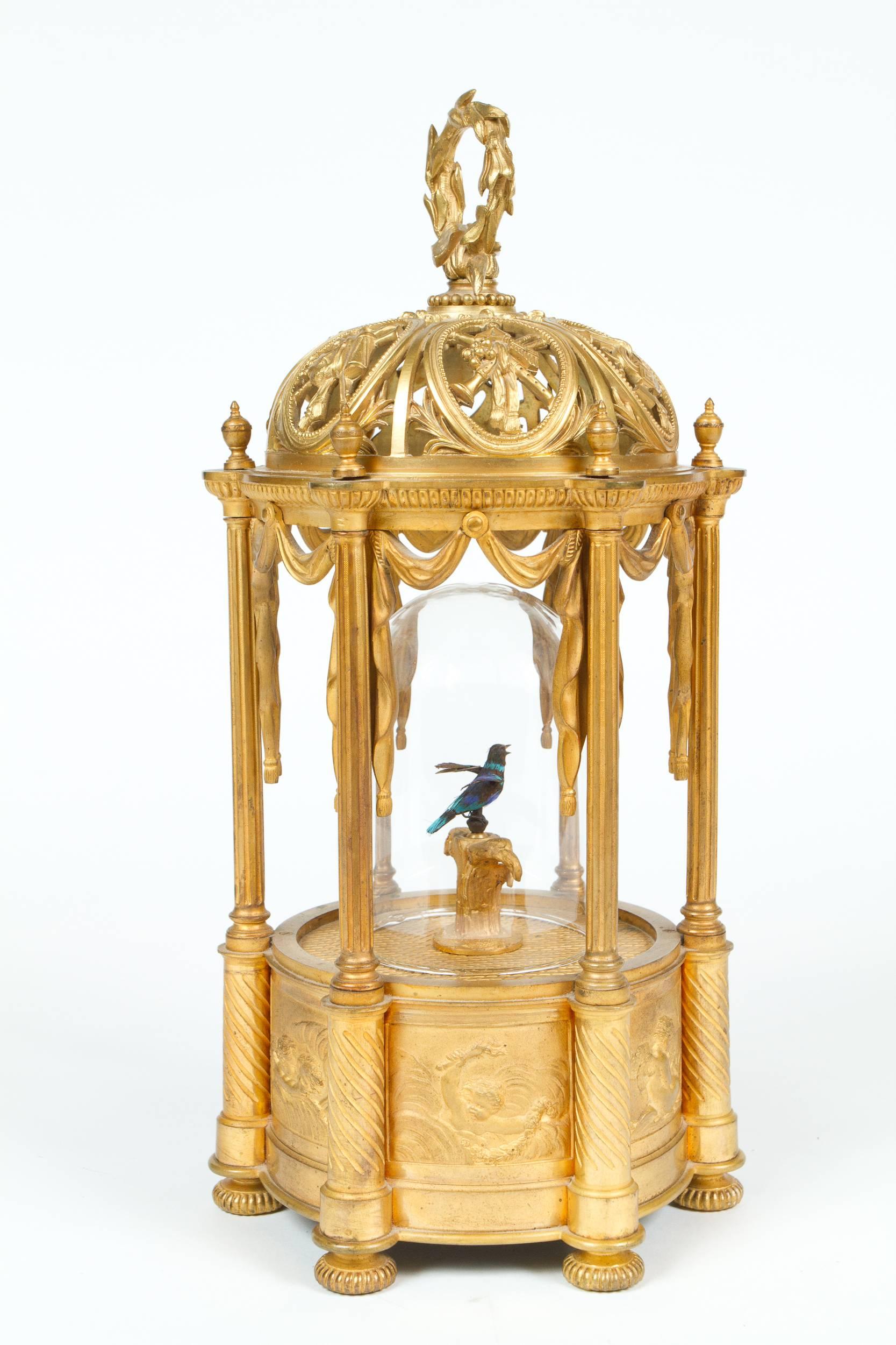 Rare and fine French antique  singing bird automaton attributed to Bontems displayed in beautiful neoclassical style gilt bronze cage. The complex, 19th century mechanism recreates extremely realistic birdsong via a system of springs, gears, bellows