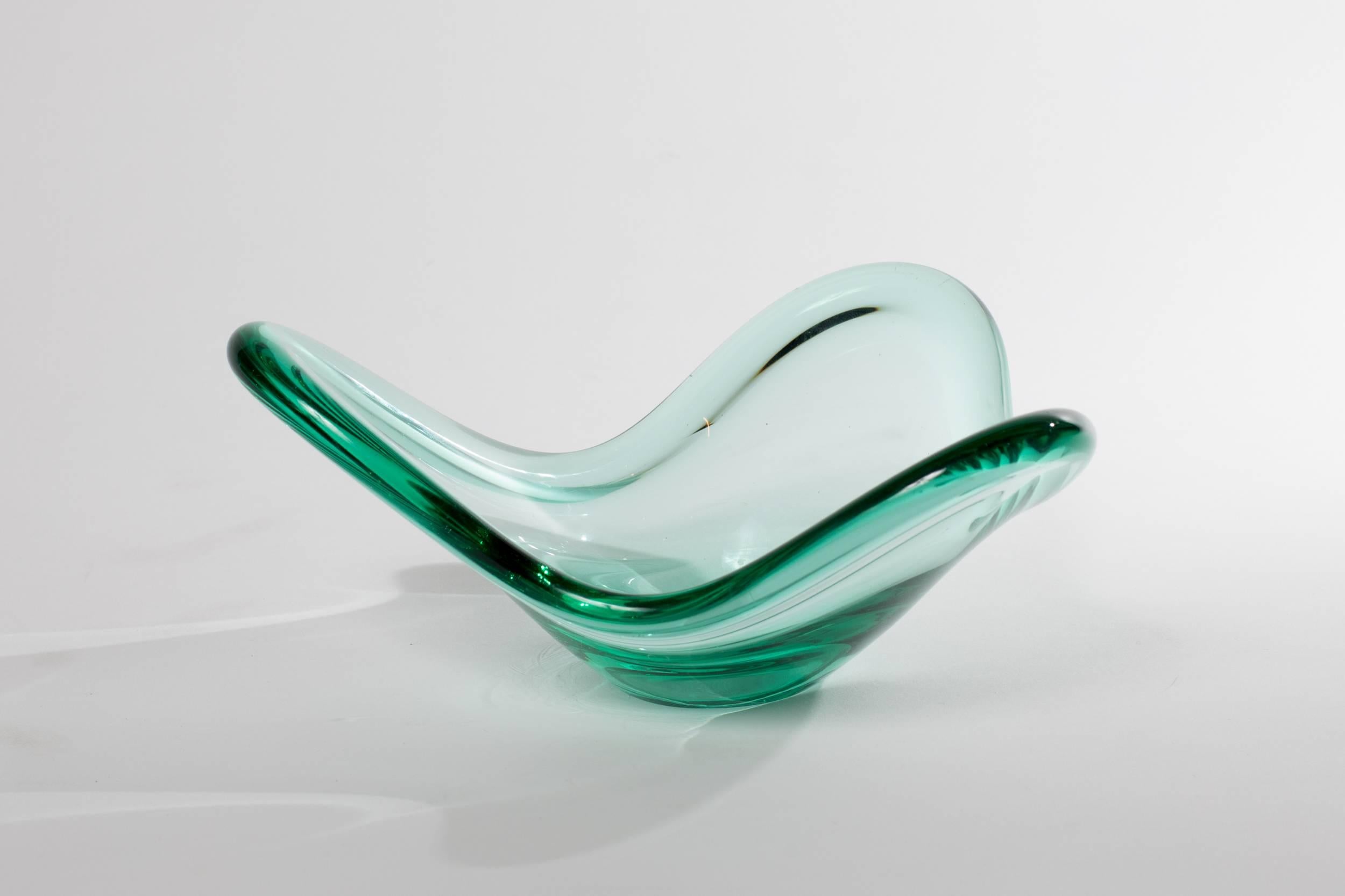 Holmegaard biomorphic glass bowl by Per Lutken. Etched signature at the base.