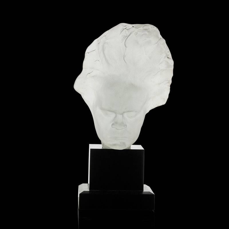 Frosted, cast glass, Art Deco Beethoven bust table lamp, resting on bronze base. Base stamped 