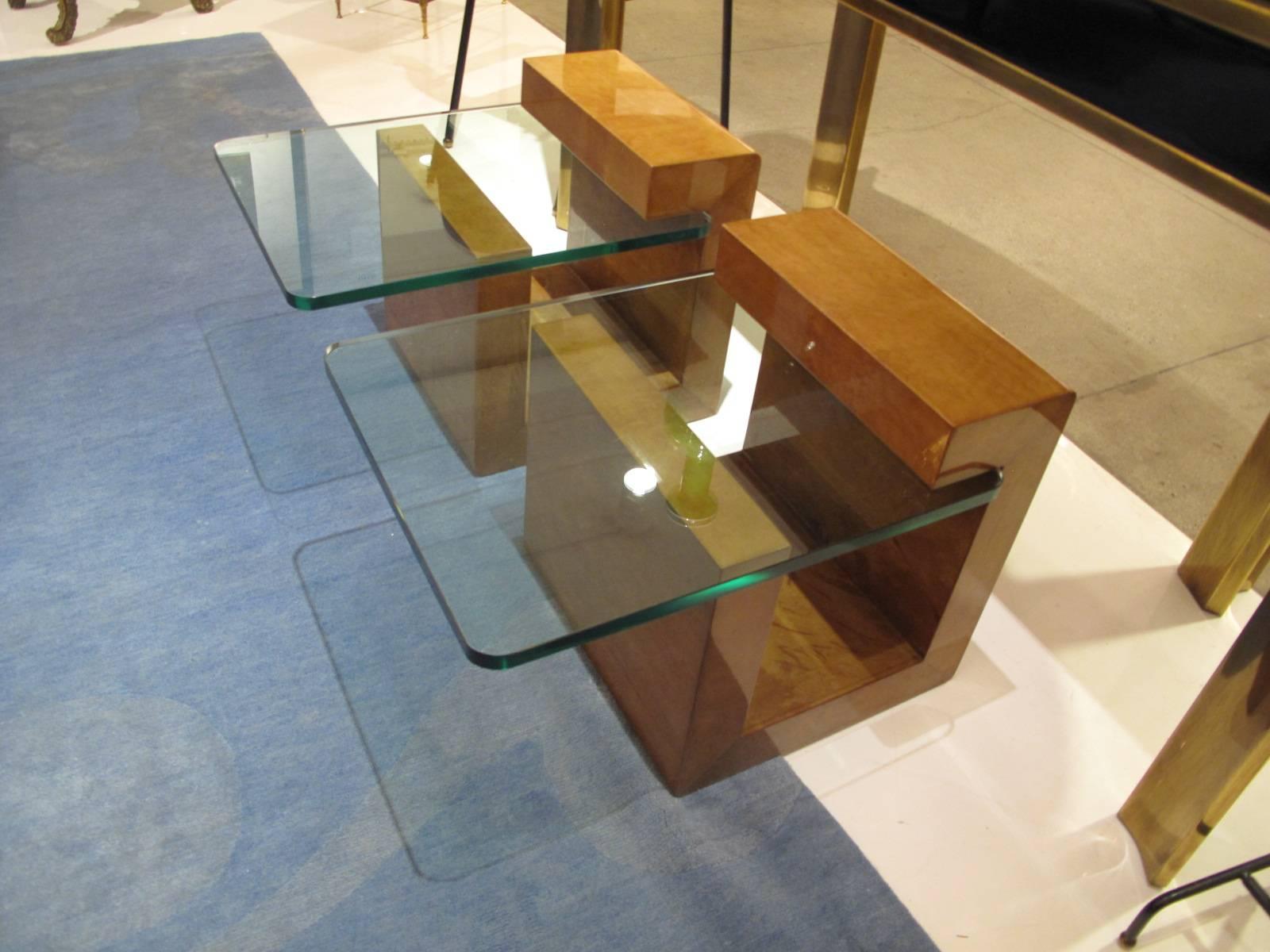 Unusual pair of lacquered parchment side tables by Karl Springer with interlocking glass top.