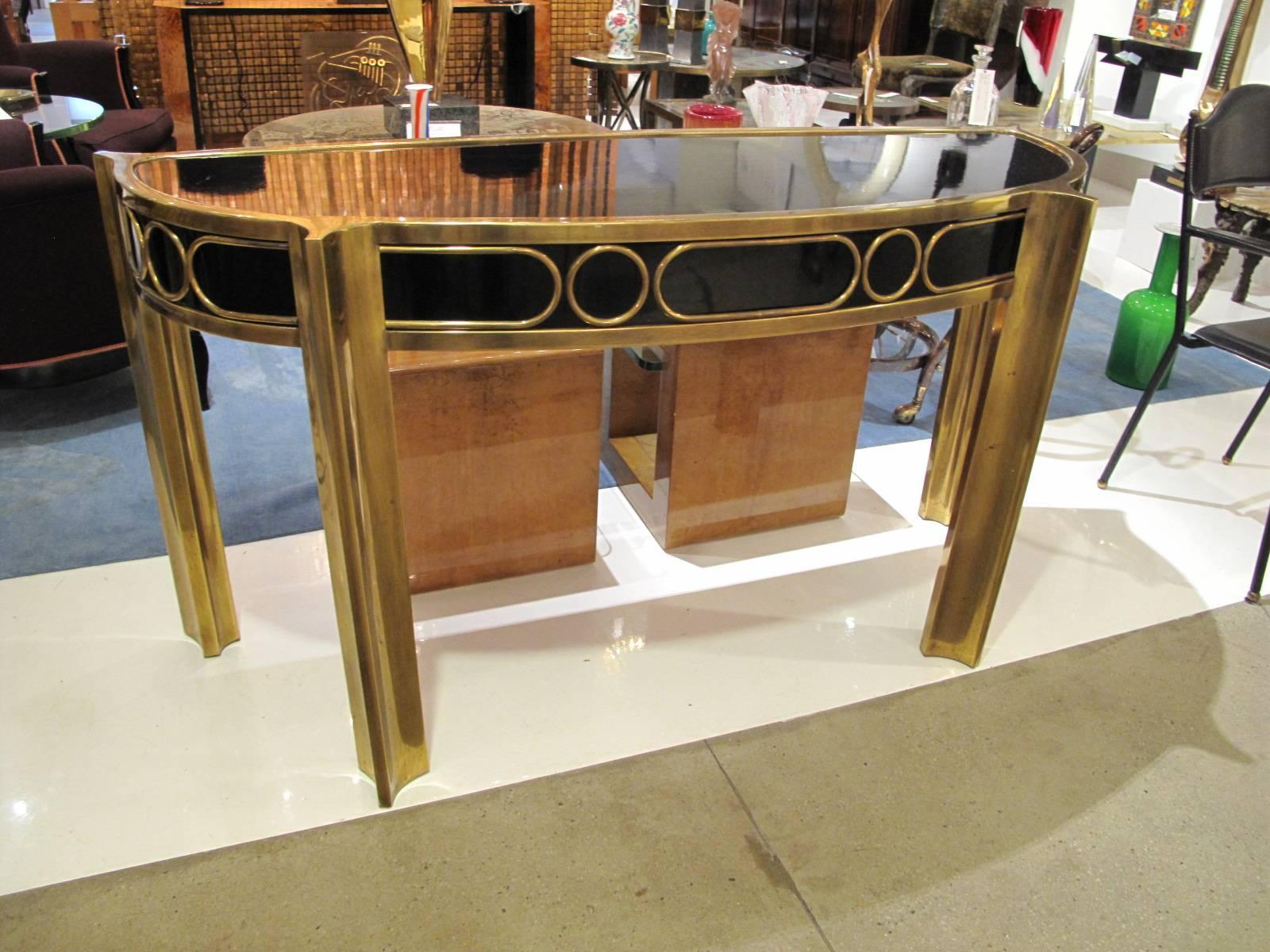 Demilune patinated brass console table with black enameled wood by Mastercraft.