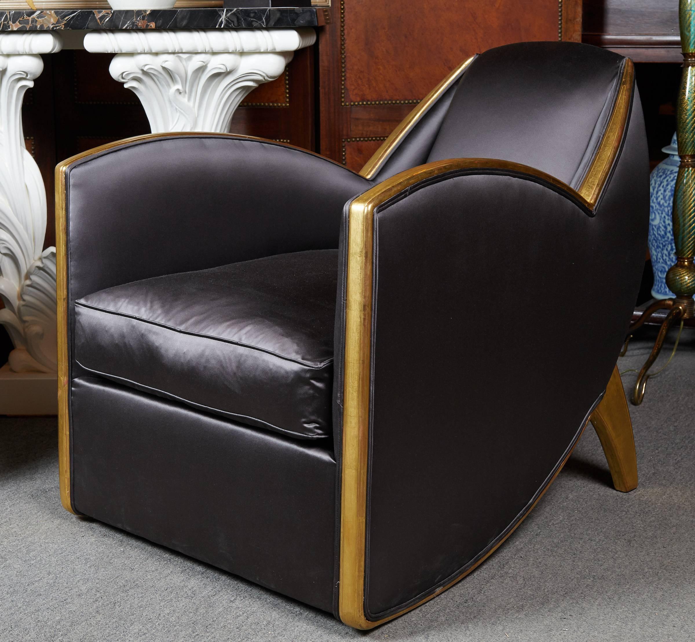 Extremely fine and stylish pair of French Art Deco style gilt wood  armchairs  upholstered in a dark grey satin fabric by Decoration Levitan.