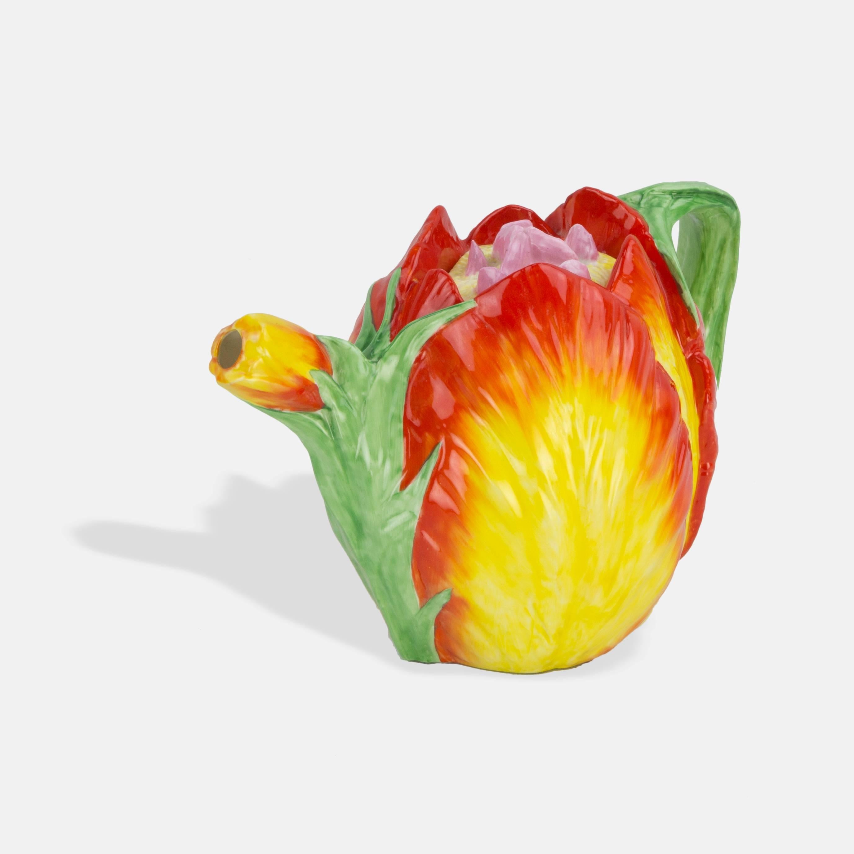 Large fine pottery floral Tulip bodied teapot with relief modeling and beautiful realistic vibrant lead glaze colors enhancing the striking images of tulips and leaves, extending to the spout and handle; exceptionally well executed. Marked: