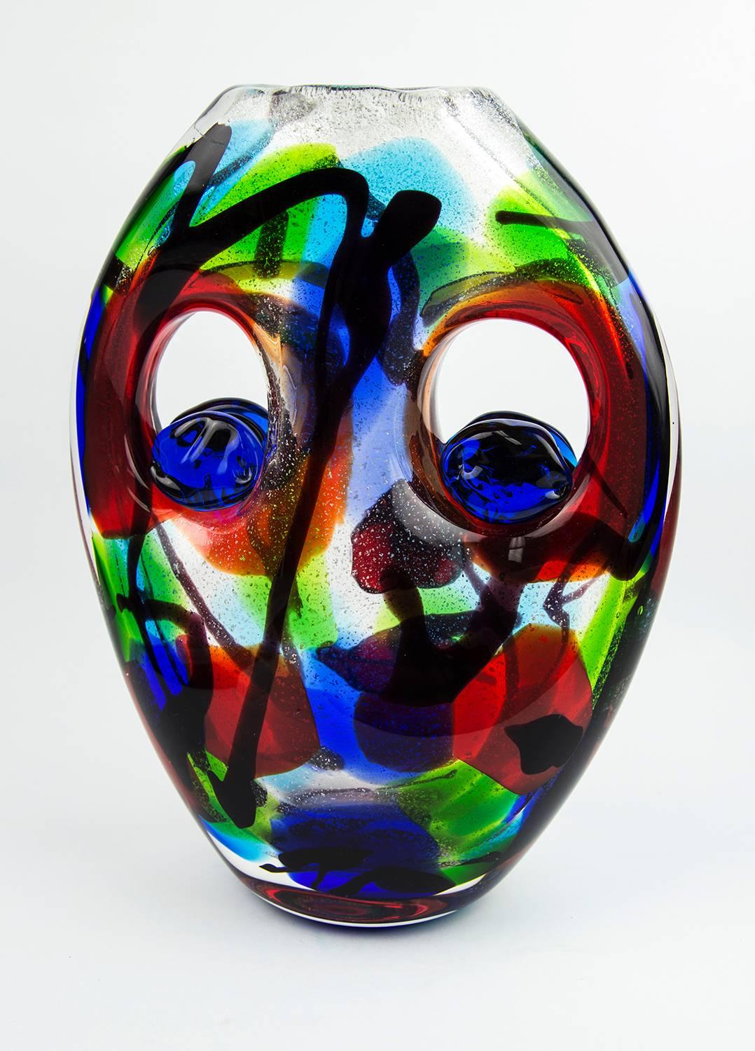 Striking unique two face design multi Sommerso world class art glass vase; high quality with intense reflecting colors including silver leaf inclusions;
 applied to both sides of  the double openings in the  vase, the brilliant blue eyes stare