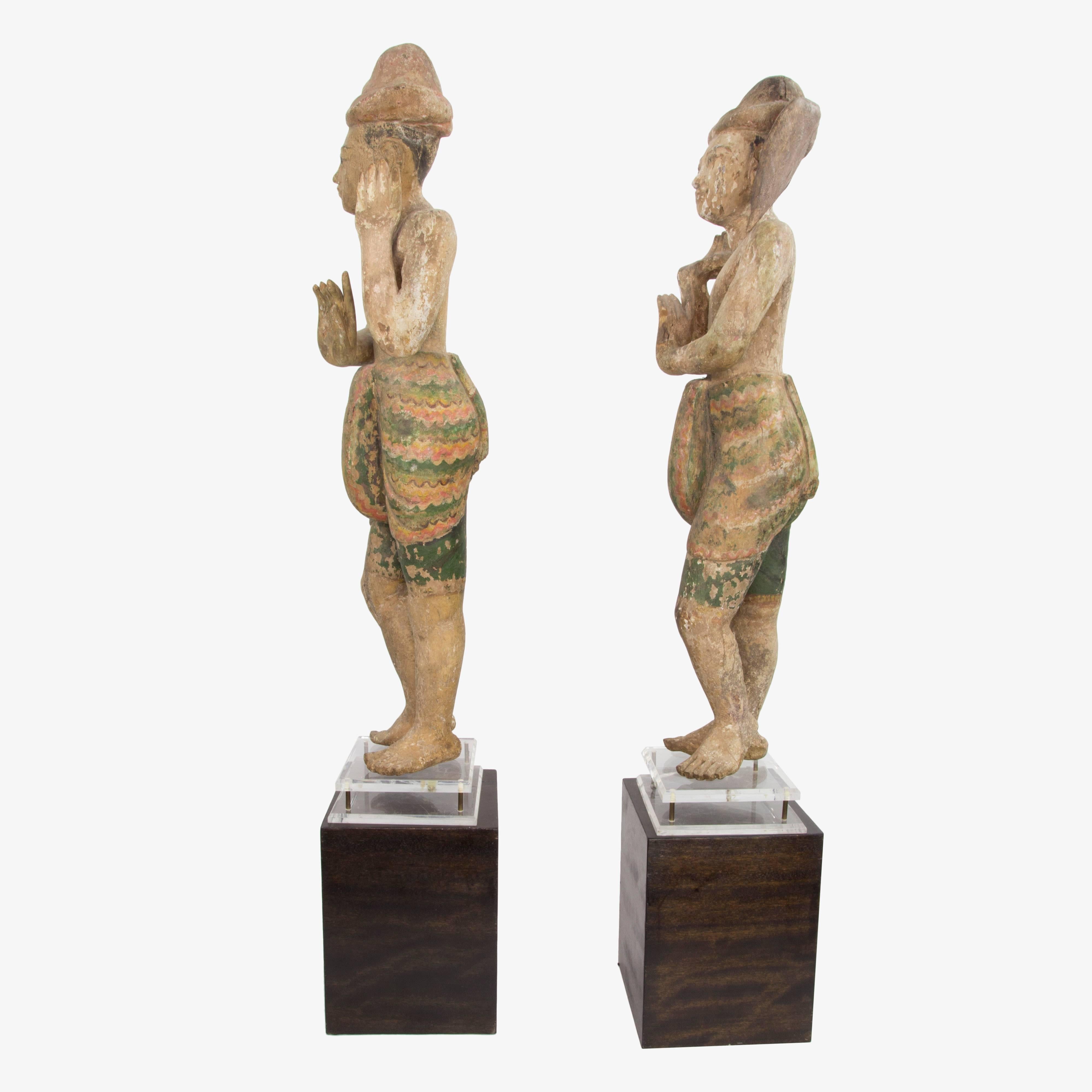 Impressive Finely detailed Pair of Burmese Temple Wood Statues. Rendered with Poly-chrome traces of pigments. These Temple Guard Statues would be kept close to an Ancestral Altar in order to help lead their Spirits into the Afterlife. Highly