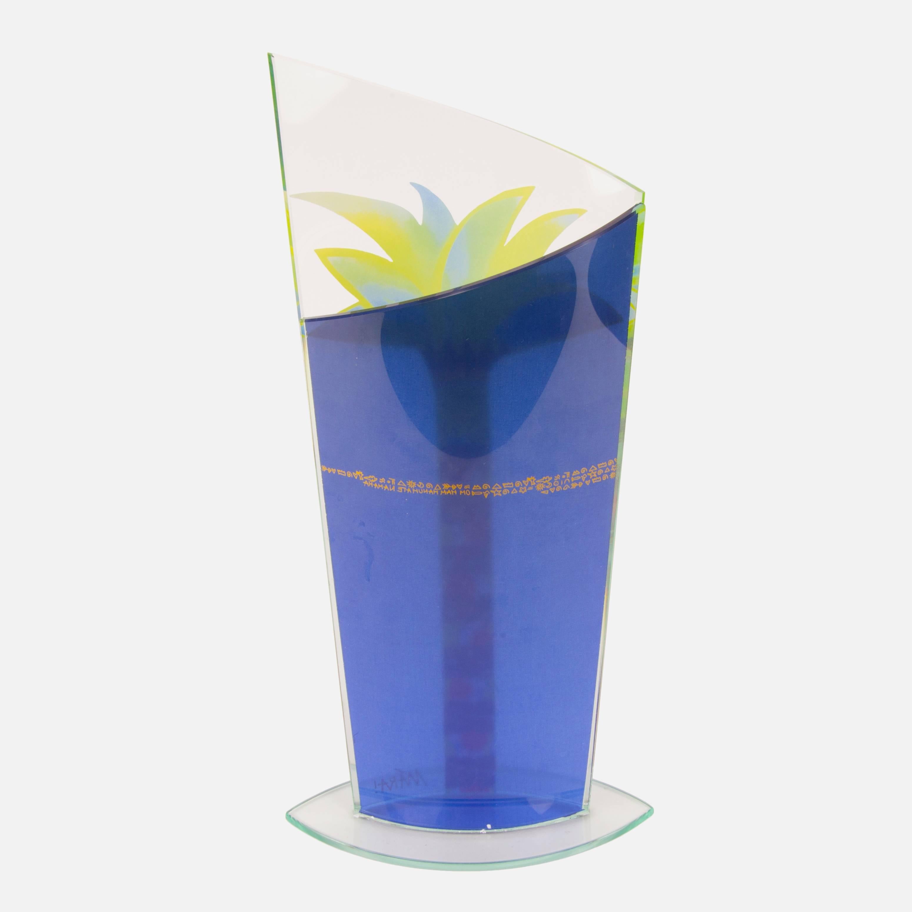 Beautifully decorated glass Handkerchief vase featuring a hand-painted palm tree design and hieroglyphics on the back; measure: 12.5” high x 6” wide x .5” deep.