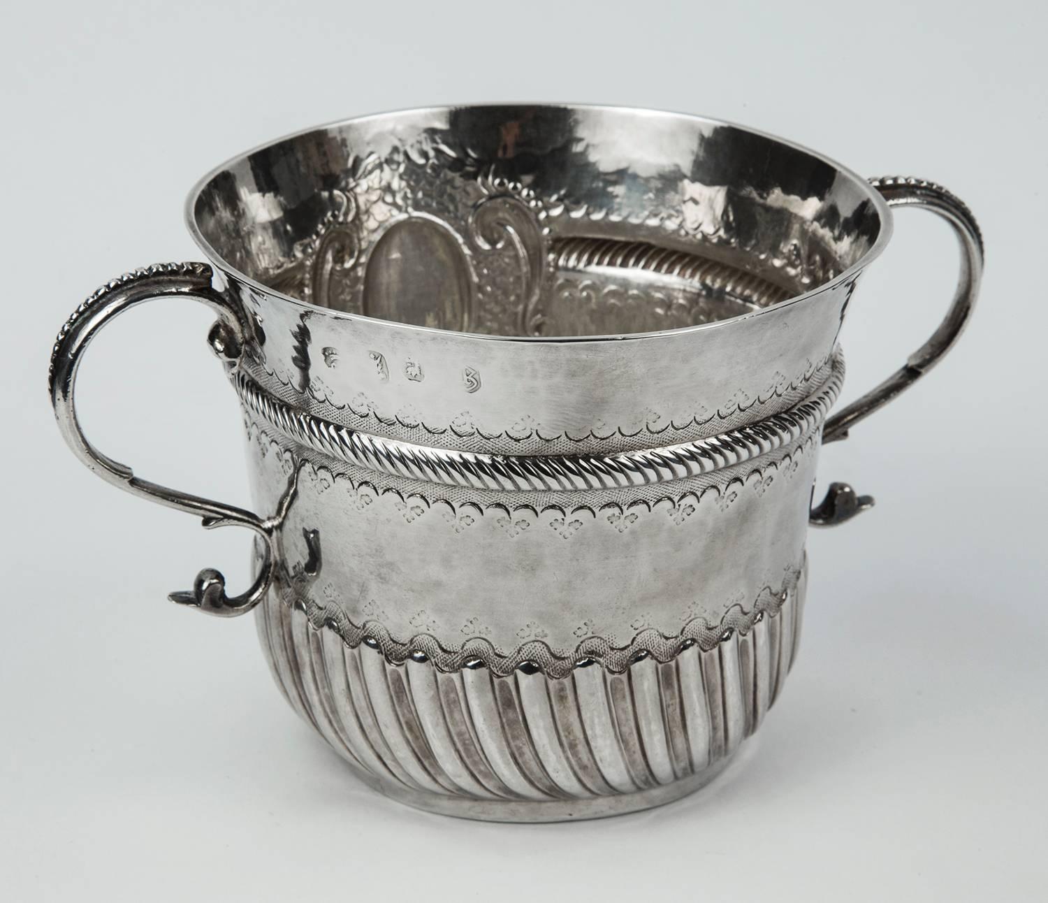 Rare Antique Britannia Silver Double Handle Presentation Cup. Circular form with slightly tapered body, spiral Gadroon punch work and Finely chased lower section with scroll and a chased Rocaille Cartouche. Twin stylized Swan Handles with beaded