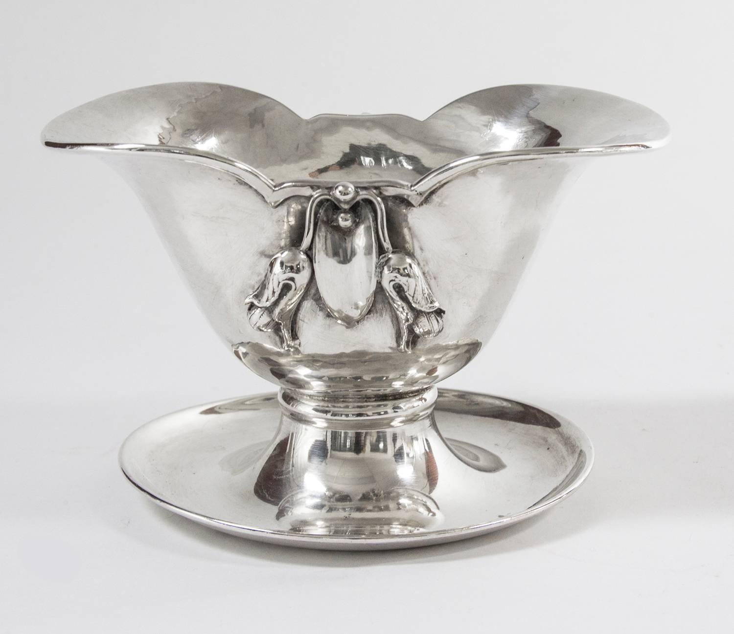 Mid-Century Modern sterling silver gravy boat and matching ladle by renowned Canadian silversmith Carl Poul Petersen, adorned with blossom or pea pod like flowers, hand-hammered, no monograms or engraving, signed 