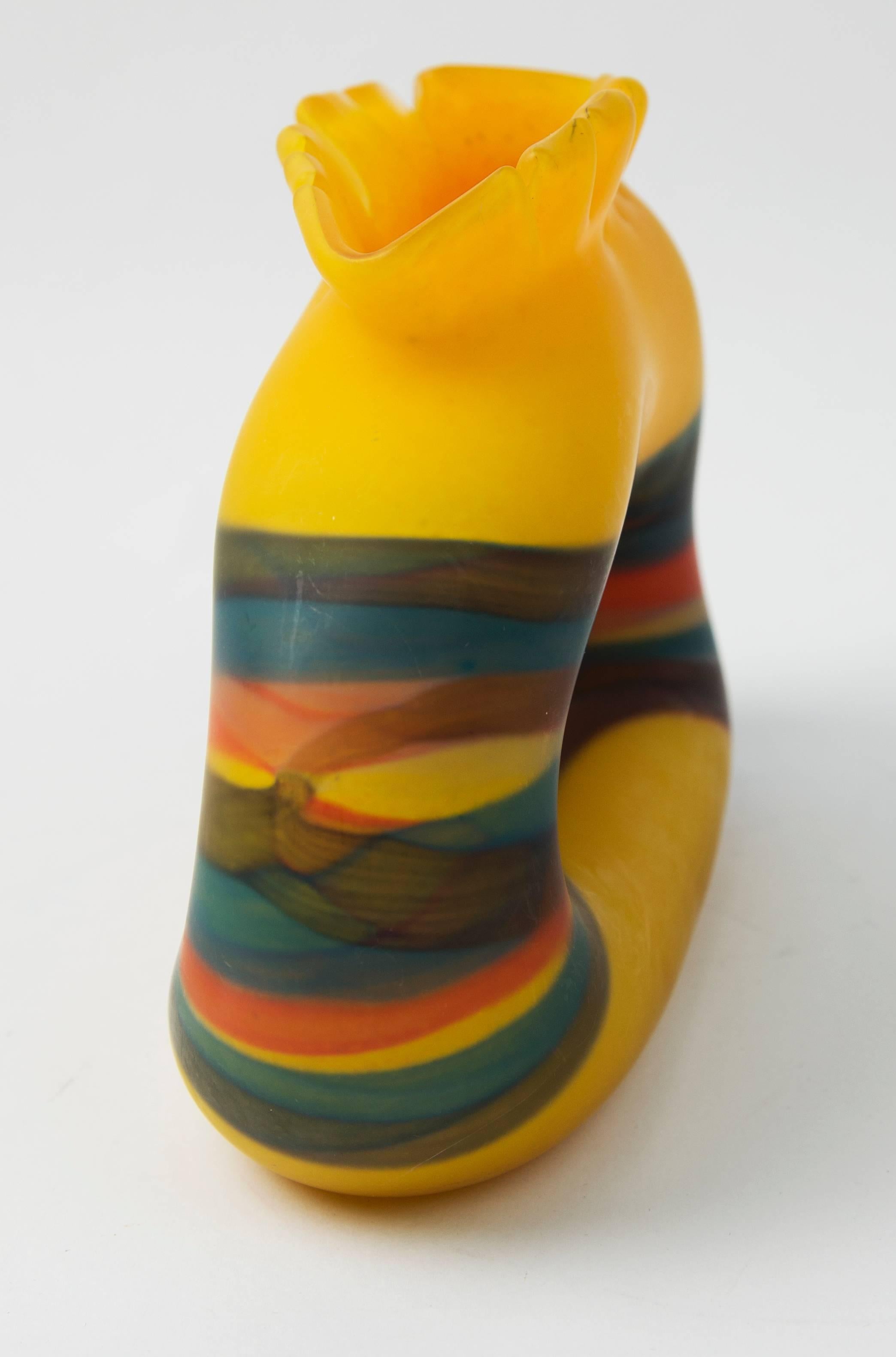 Vivid yellow and multi-color striped ovoid form vase hand blown by renowned Romanian glass artist Ioan Nemtoi (b. 1964-).
The snipped yellow lip over luminous matte yellow base with pinched center delineated by flowing multicolor bands creates a