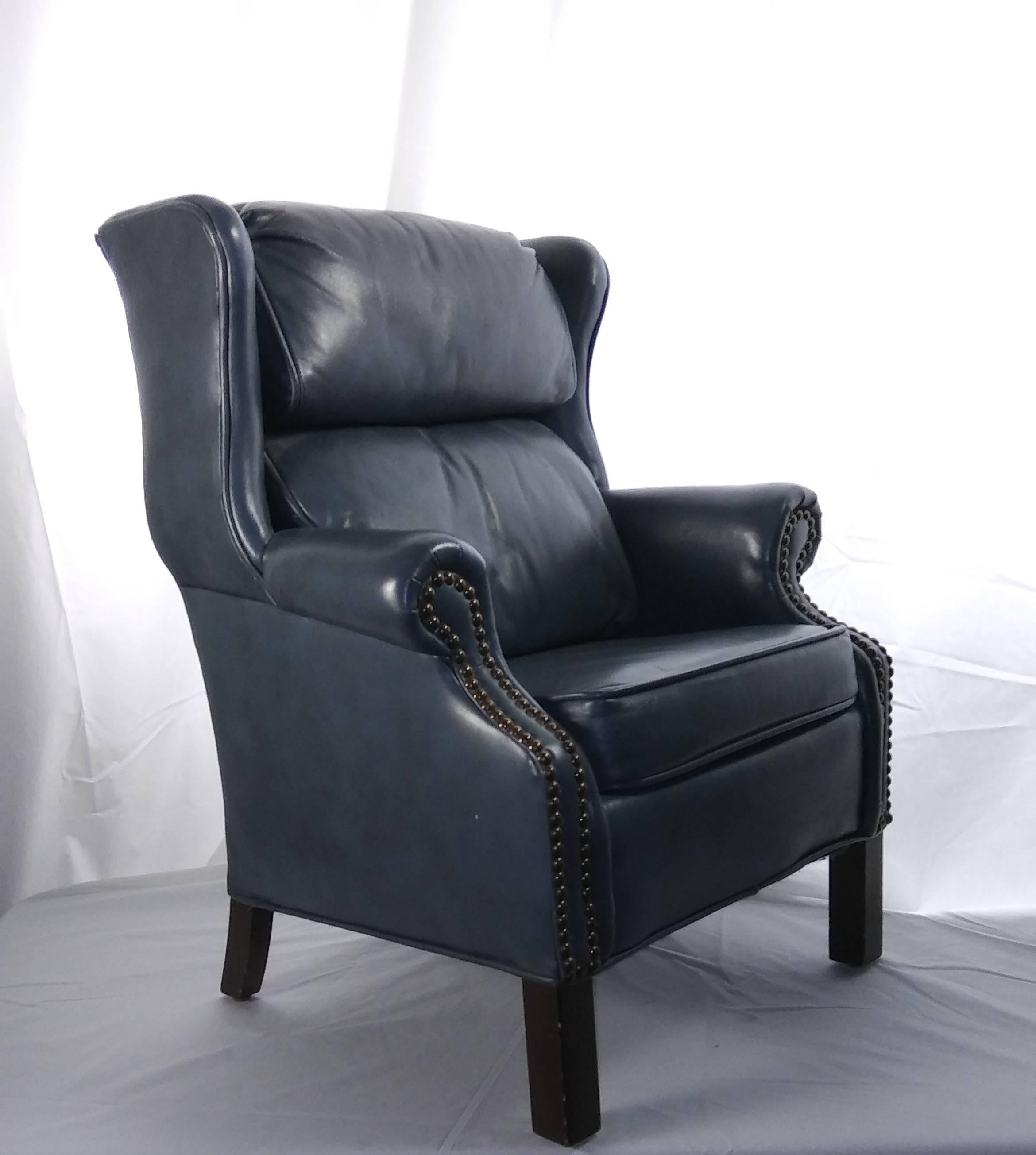 Bradington Young Child's executive blue-gray leather wing back chair, equipped with cushioned headrest and backrest over square seat cushion with piping trim; double nail-head trim to the set-back rolled arms, and raised on mahogany legs.
Perfect