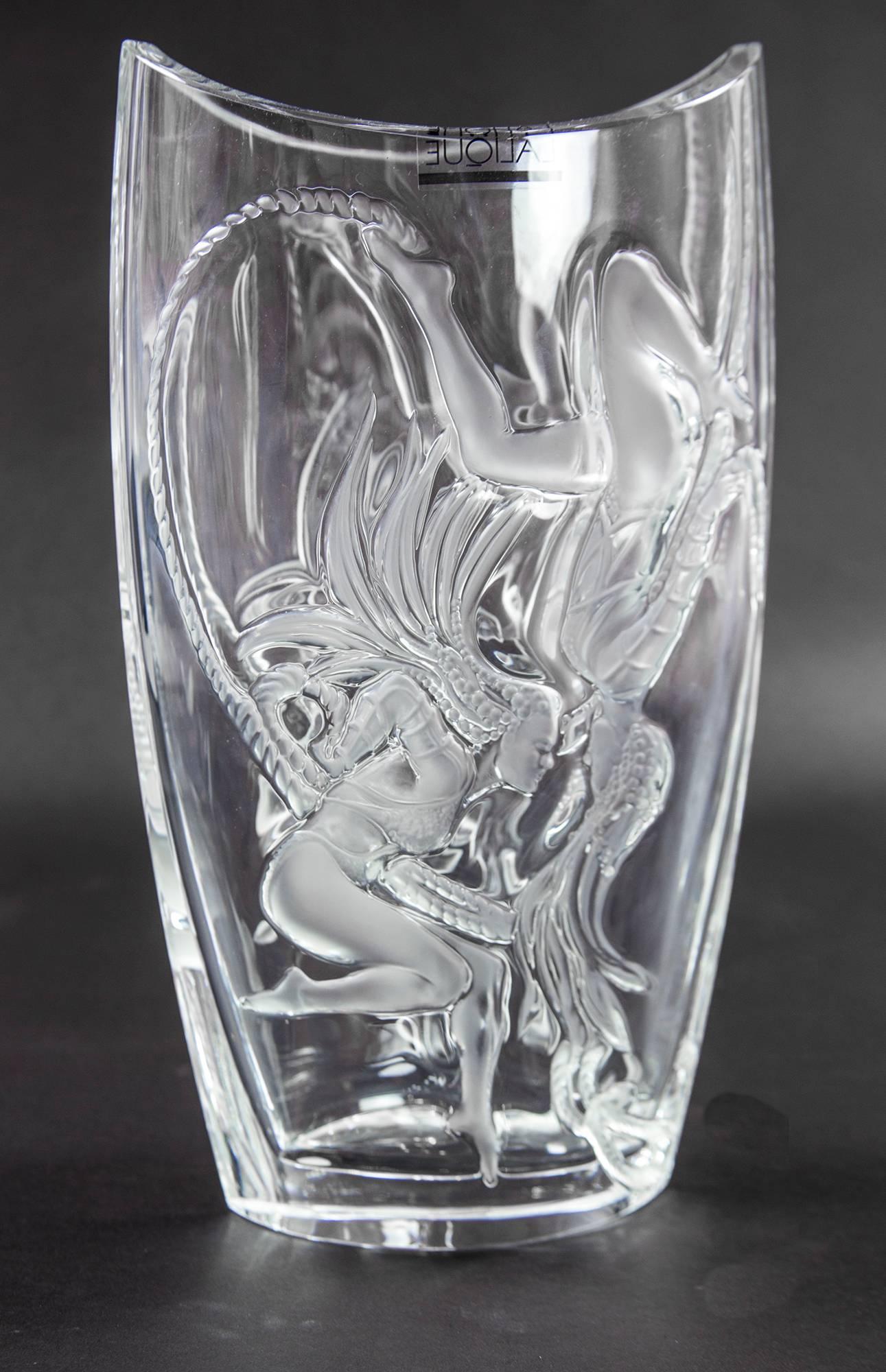 A magnificent Lalique crystal vase, depicting highly stylized frosted acrobatic figures on clear ground; one side of the vase the figures are in relief, on the other they are in intaglio. The exquisite design which is now retired is entitled: