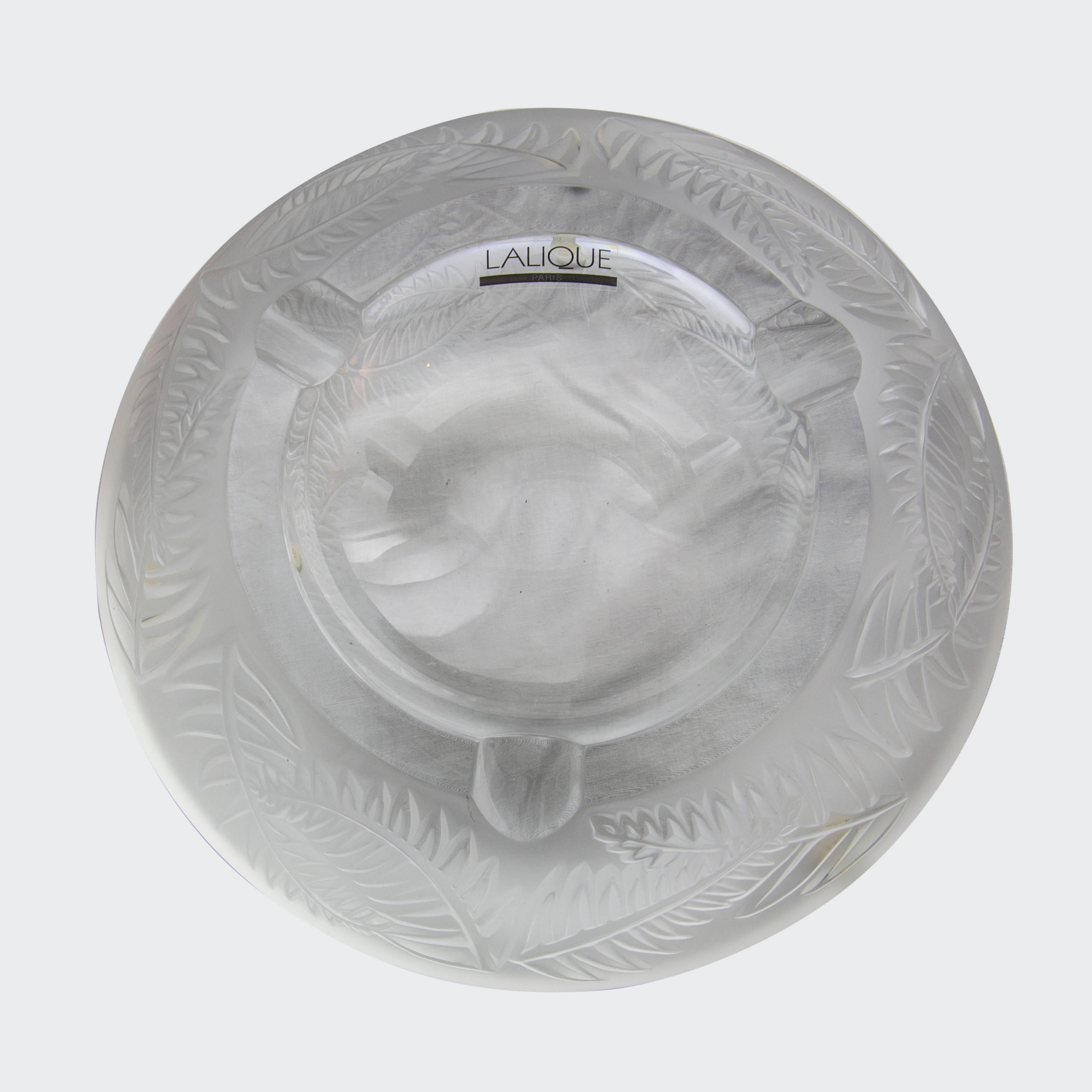 Large Lalique frosted crystal ashtray, entitled Fougères, encircled with raised fern leaf design. Designed in 2001, now retired, can be used as a bowl; this heavy ashtray is a real beauty; signed Lalique France in script to base, and Lalique Paris
