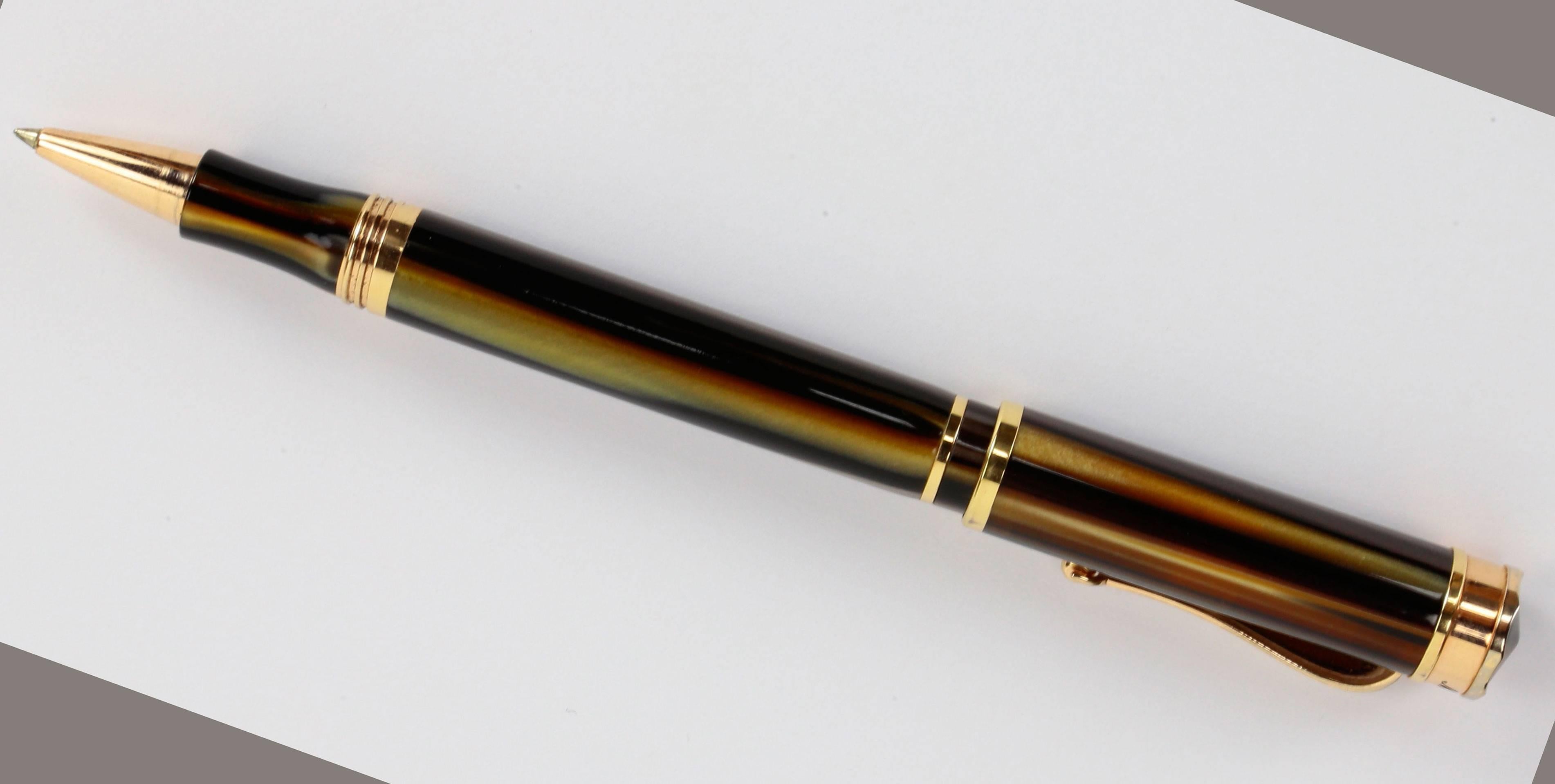 For those of us who still relish the pleasure of writing, we present the outstanding Ducale Montegrappa Italia fine writing instrument; distinctive rich brown turquoise resin finish gold trim; screw on cap; signed: Montegrappa; in original quality