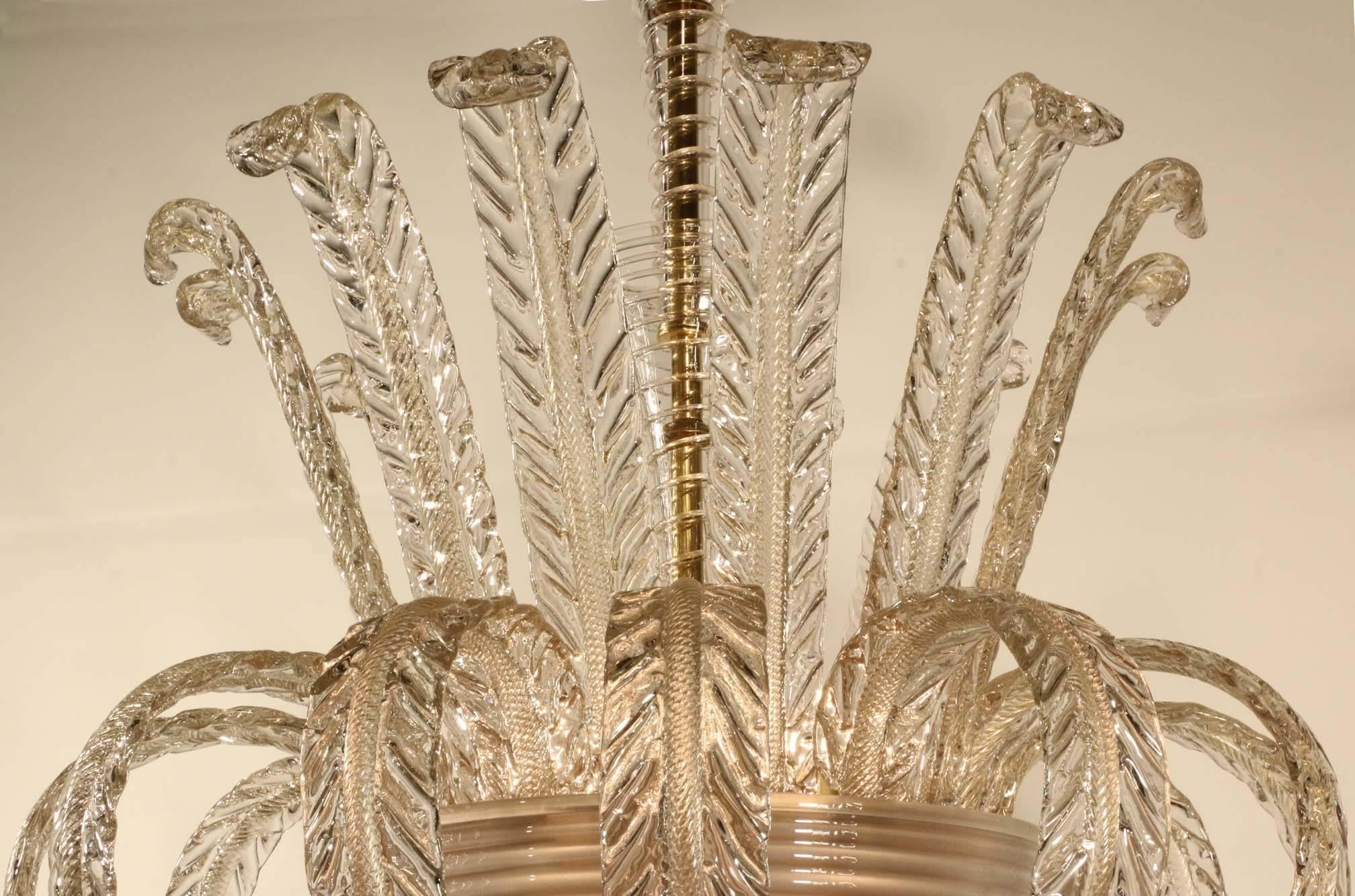 Mid-20th century Murano chandelier, in gold flecked and aventurine crystal:
The banded hemispherical bowl set with alternating raised and down-swept stylized acanthus, the central stem writhen fluted and trumpet shaped.