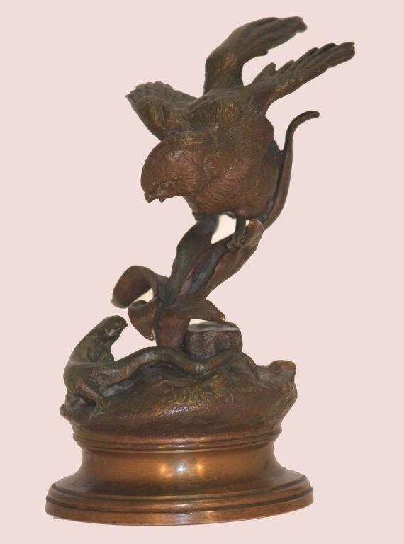 This period casting is a very fine example of a French Animalier bronze. It is crisply cast and so lacks the rather rubbery feel of the later castings. It captures dramatically the bird and lizard in confrontation, signed.